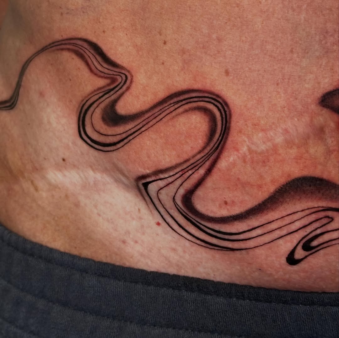 Wave pattern black and grey tattoo on the chest by 𝕳𝖆𝖓𝖓𝖆𝖍 𝕮𝖆𝖓𝖋𝖎𝖊𝖑𝖉 ✨ Memphis Tattoo Artist, Memphis, Tennessee