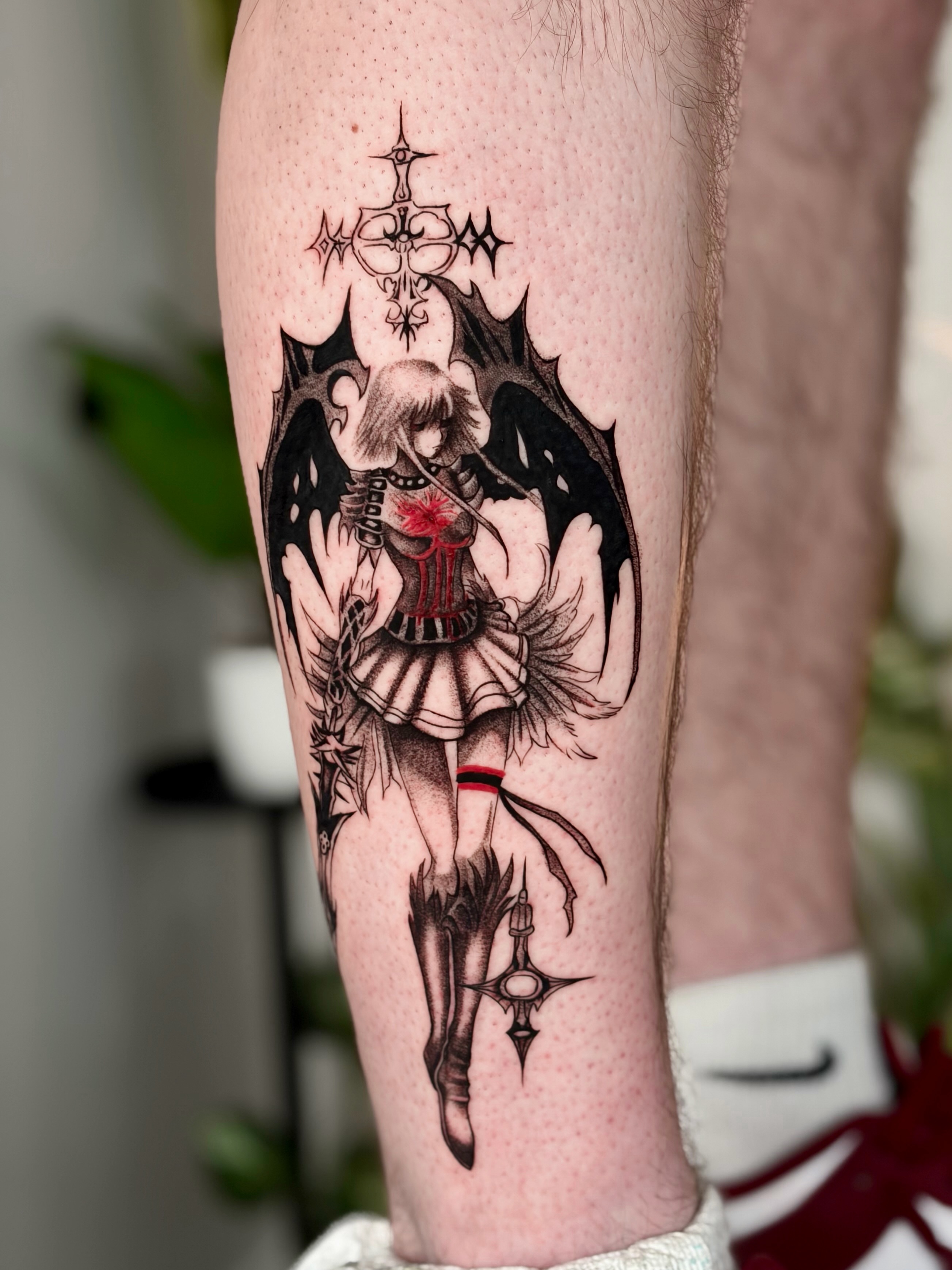 Doll with wings dark realism tattoo on the calf by Quinn ᶻ 𝗓 𐰁 .ᐟ, Charlotte, North Carolina