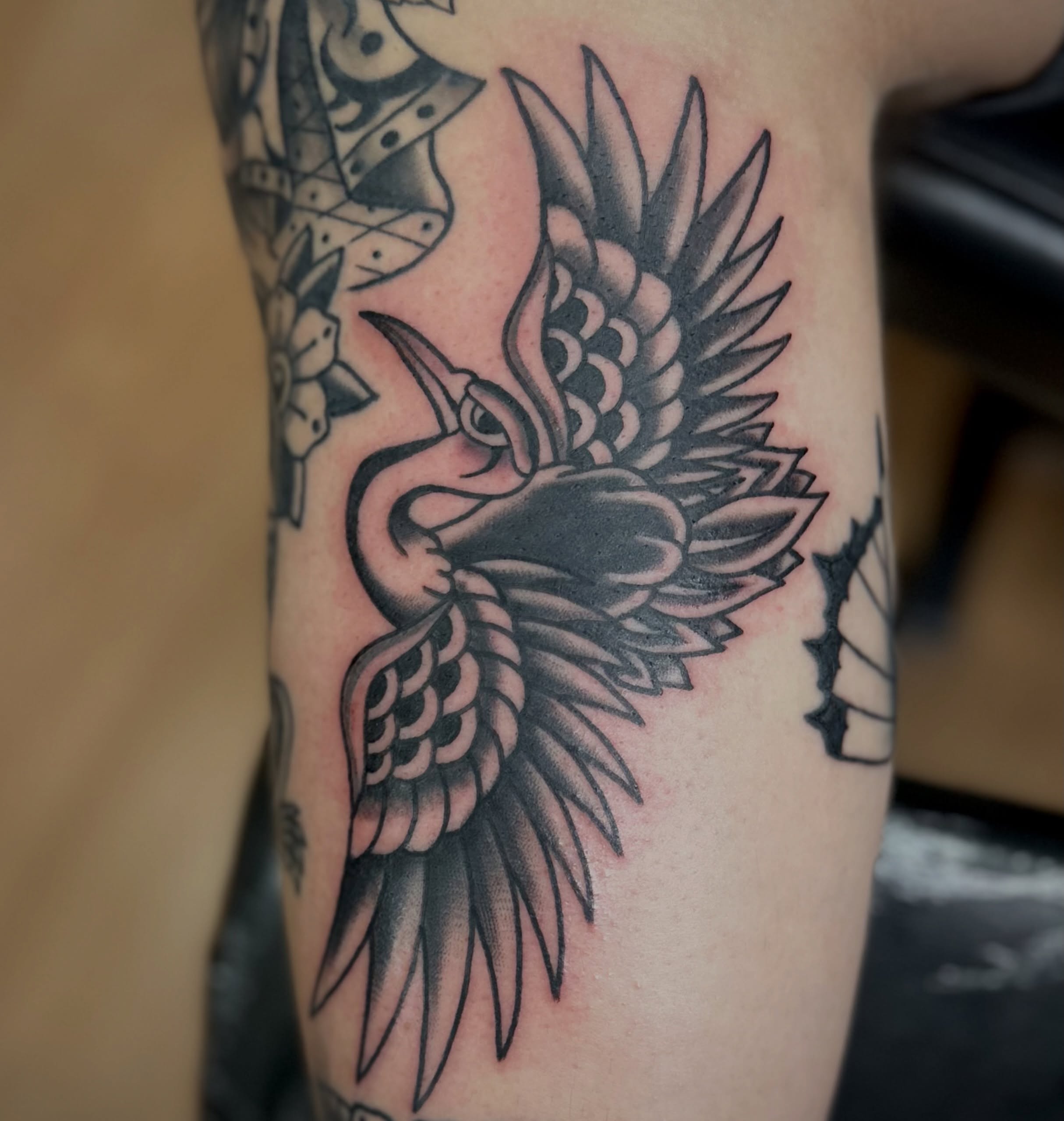 Heron black and grey tattoo on the forearm by Josh Robinson