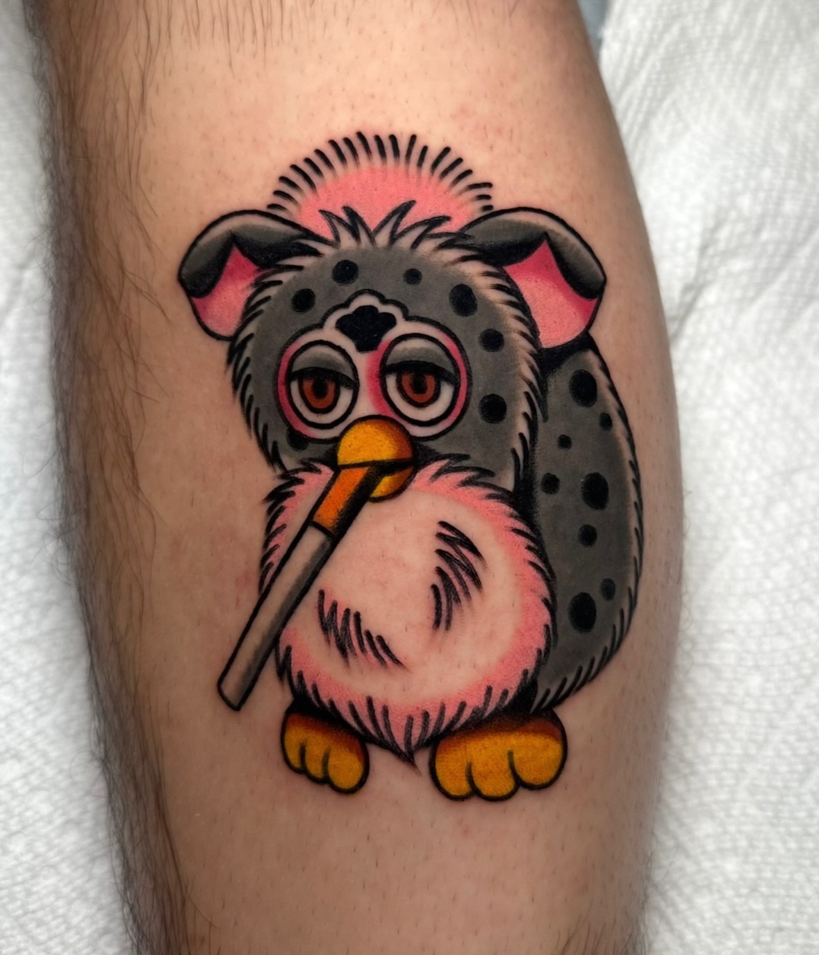 Dog with microphone American traditional tattoo on the forearm by Zahra Niedermann