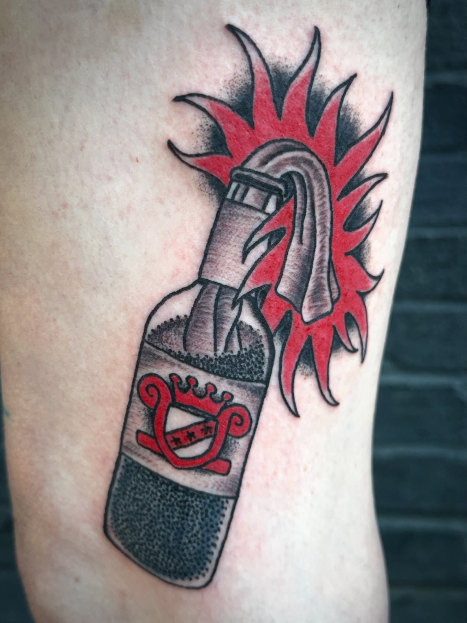 Flaming bottle dotwork tattoo on the forearm by Chris Blanchard