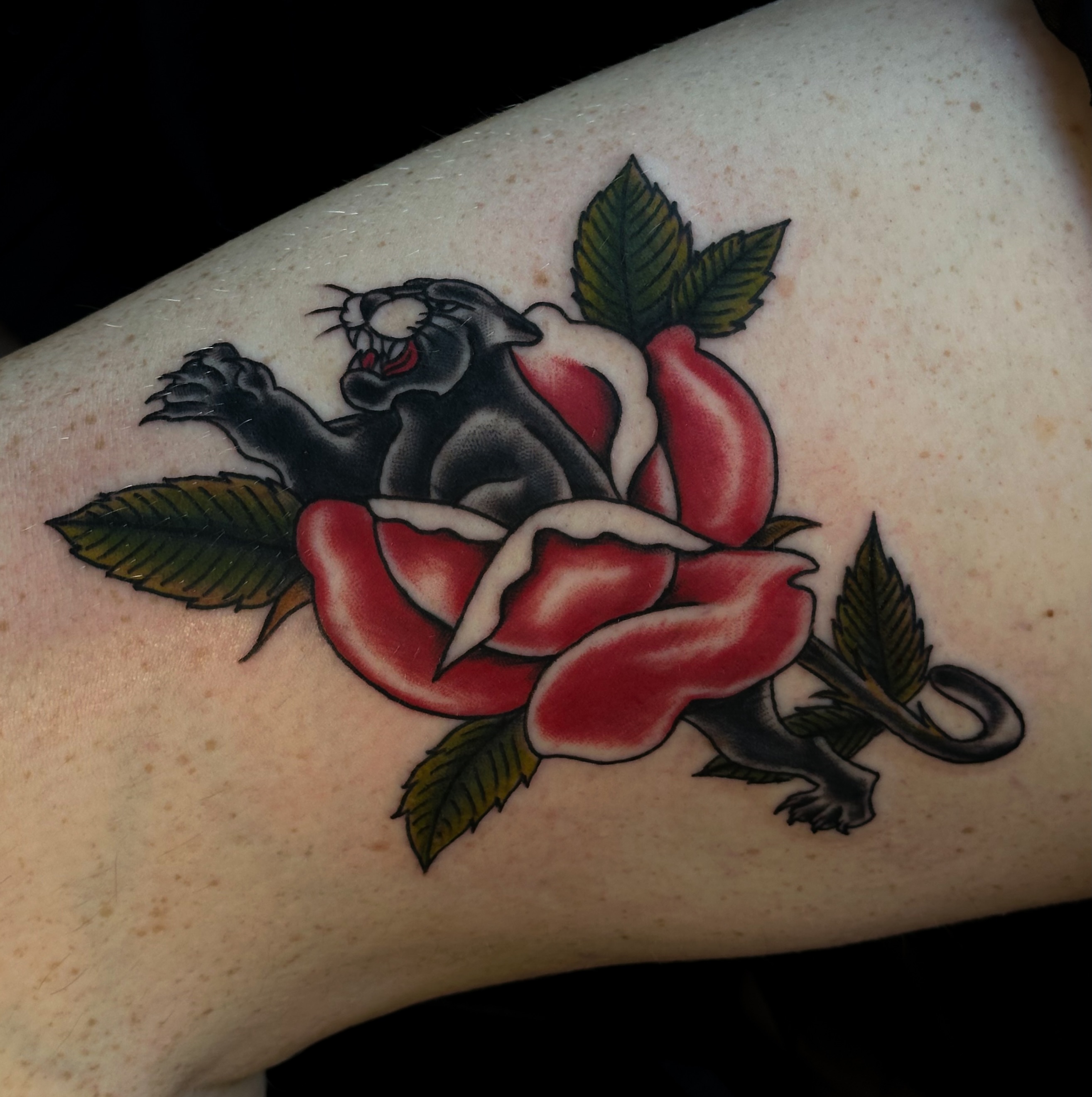 Panther and rose American traditional tattoo on the forearm by Victoria