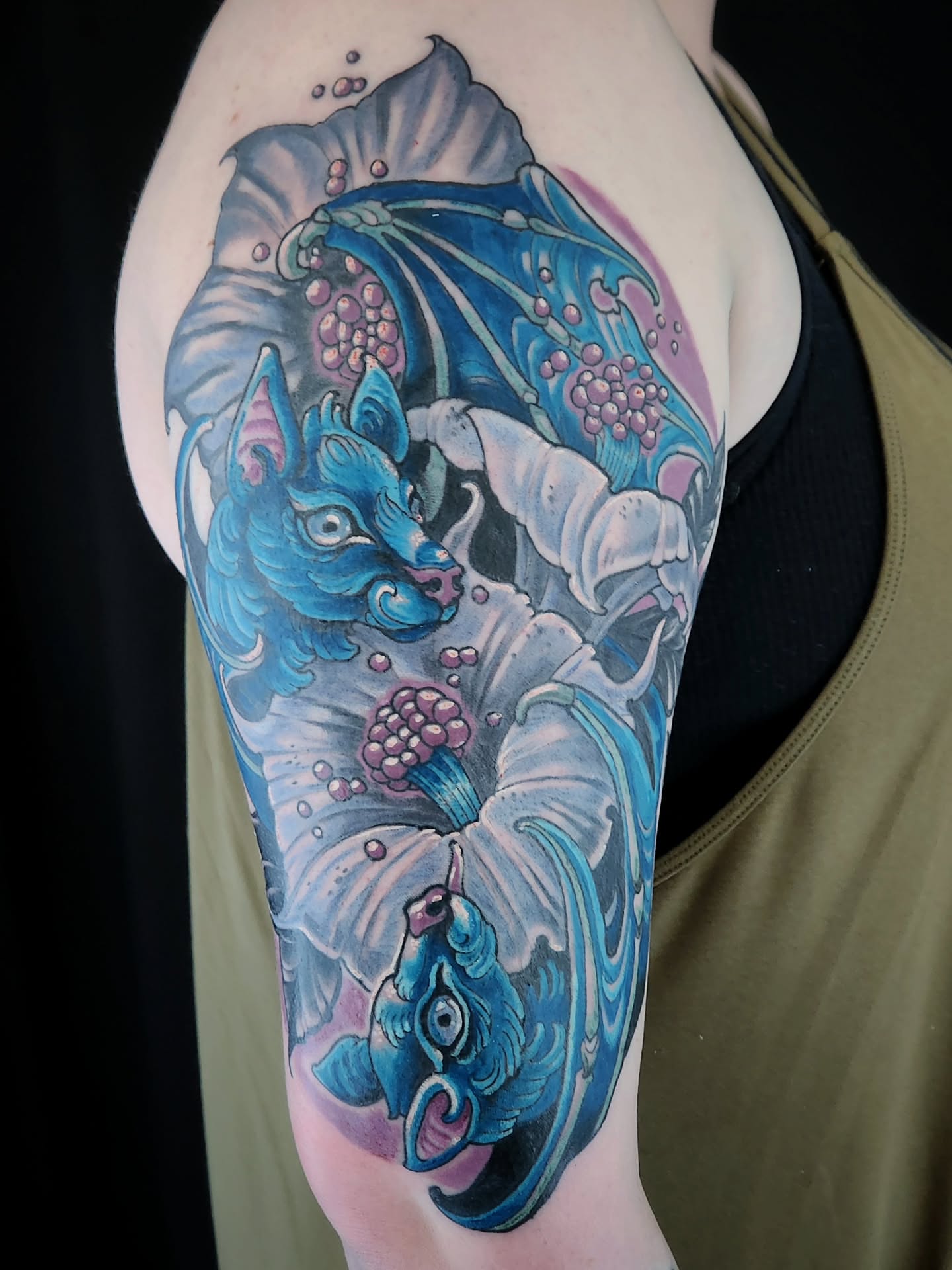 Dragon and lotus dotwork tattoo on the shoulder by Randy