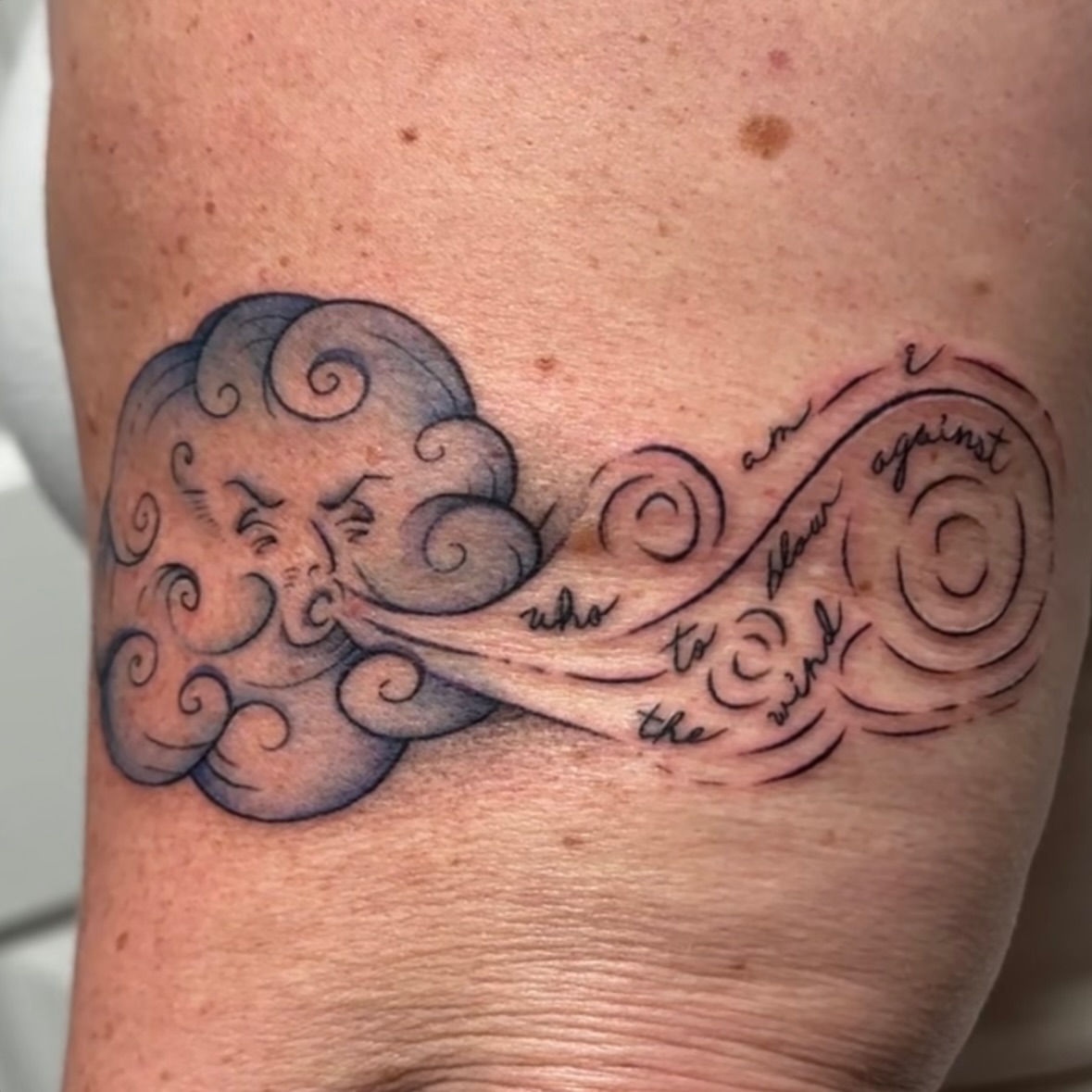 Wind and cloud black and grey tattoo on the forearm by Jocelyn