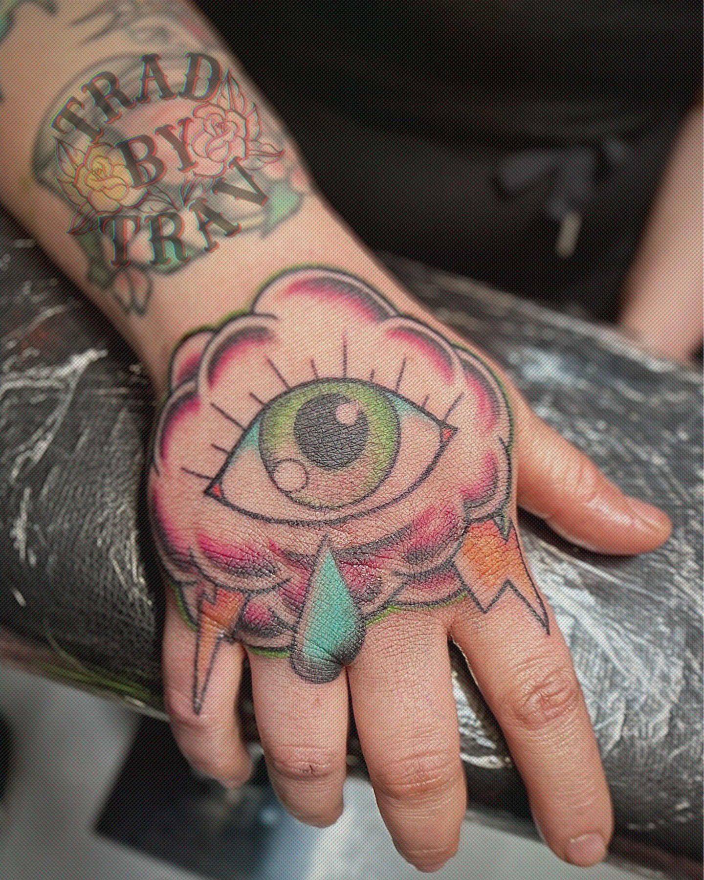 Eye with tear drop American traditional tattoo on the hand by Travis B