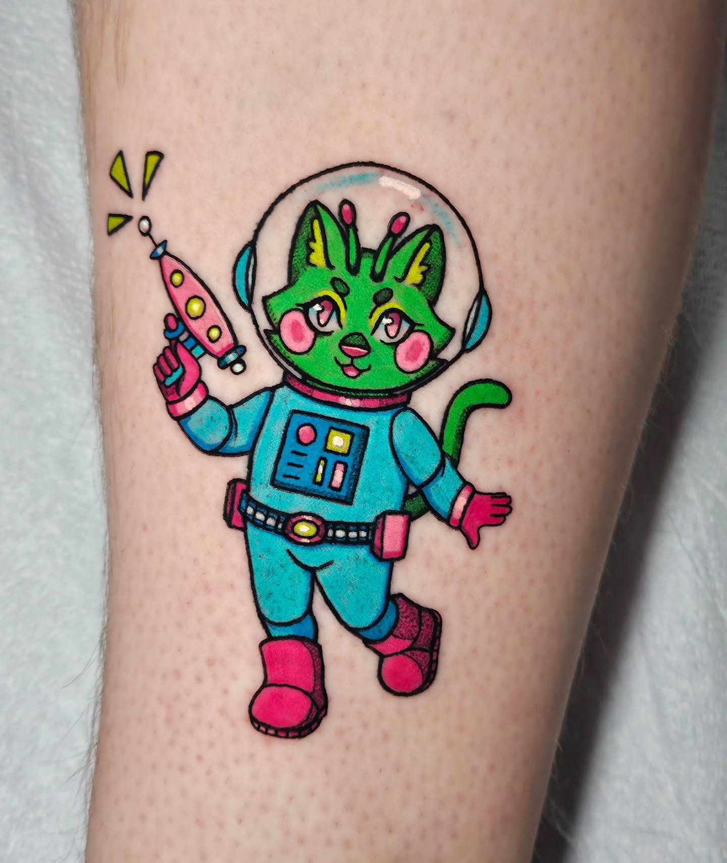 Space cat astronaut new school tattoo on the forearm by Gray