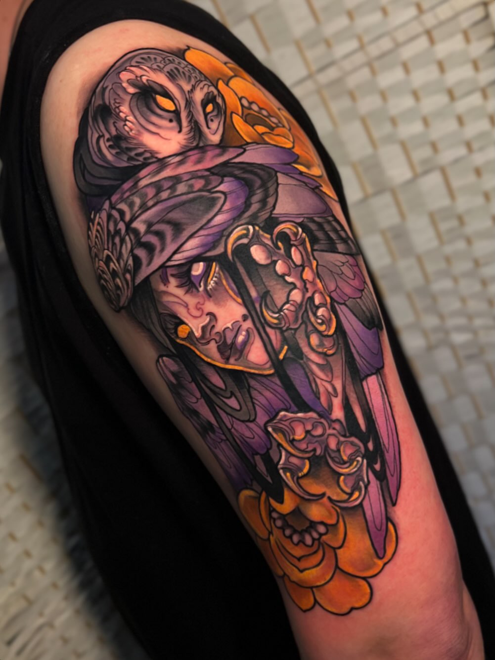 Owl and skull American traditional tattoo on the upper arm by Jen Love