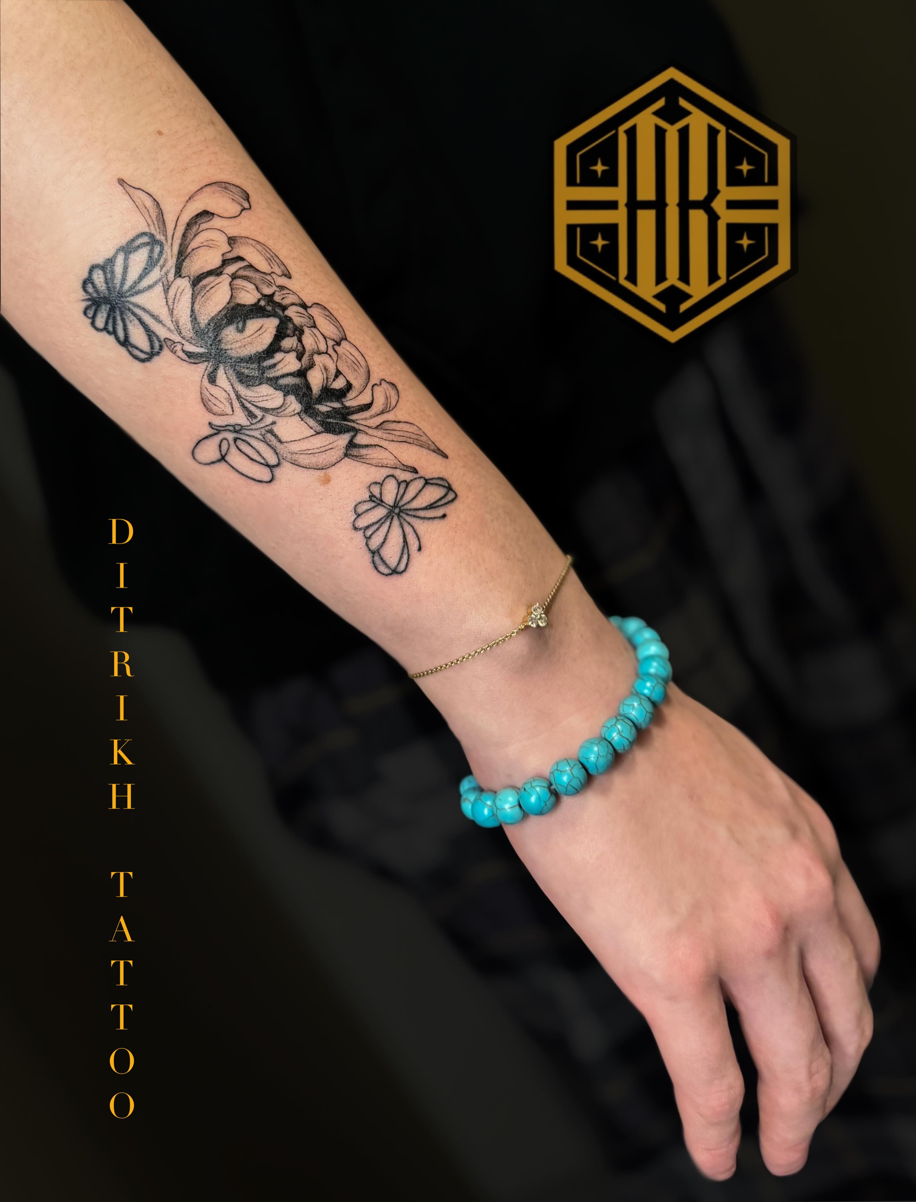 Floral arrangement black and grey tattoo on the forearm by KET, Calgary, Alberta