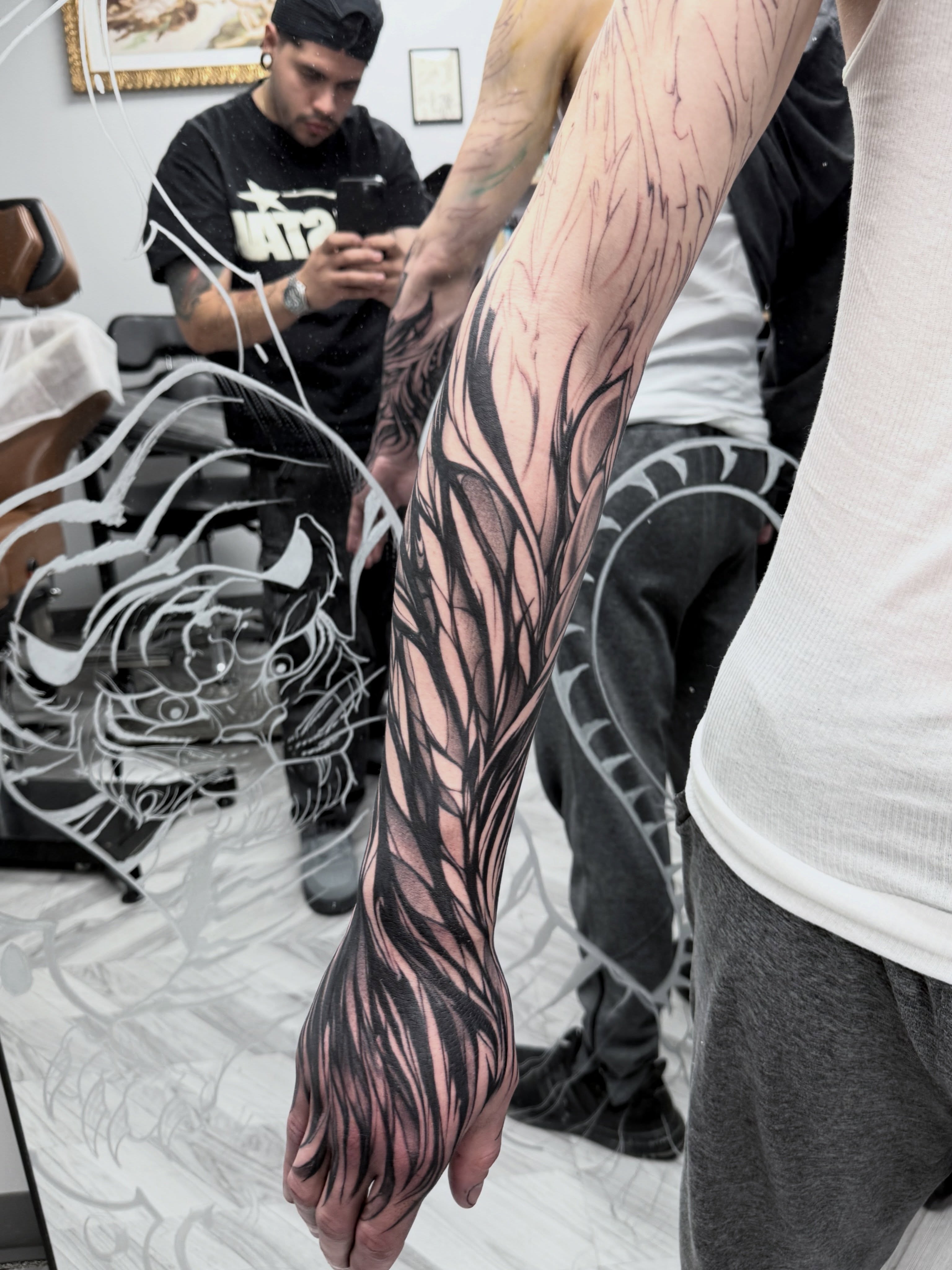 Abstract organic pattern black and grey tattoo on the upper arm by Sebastian