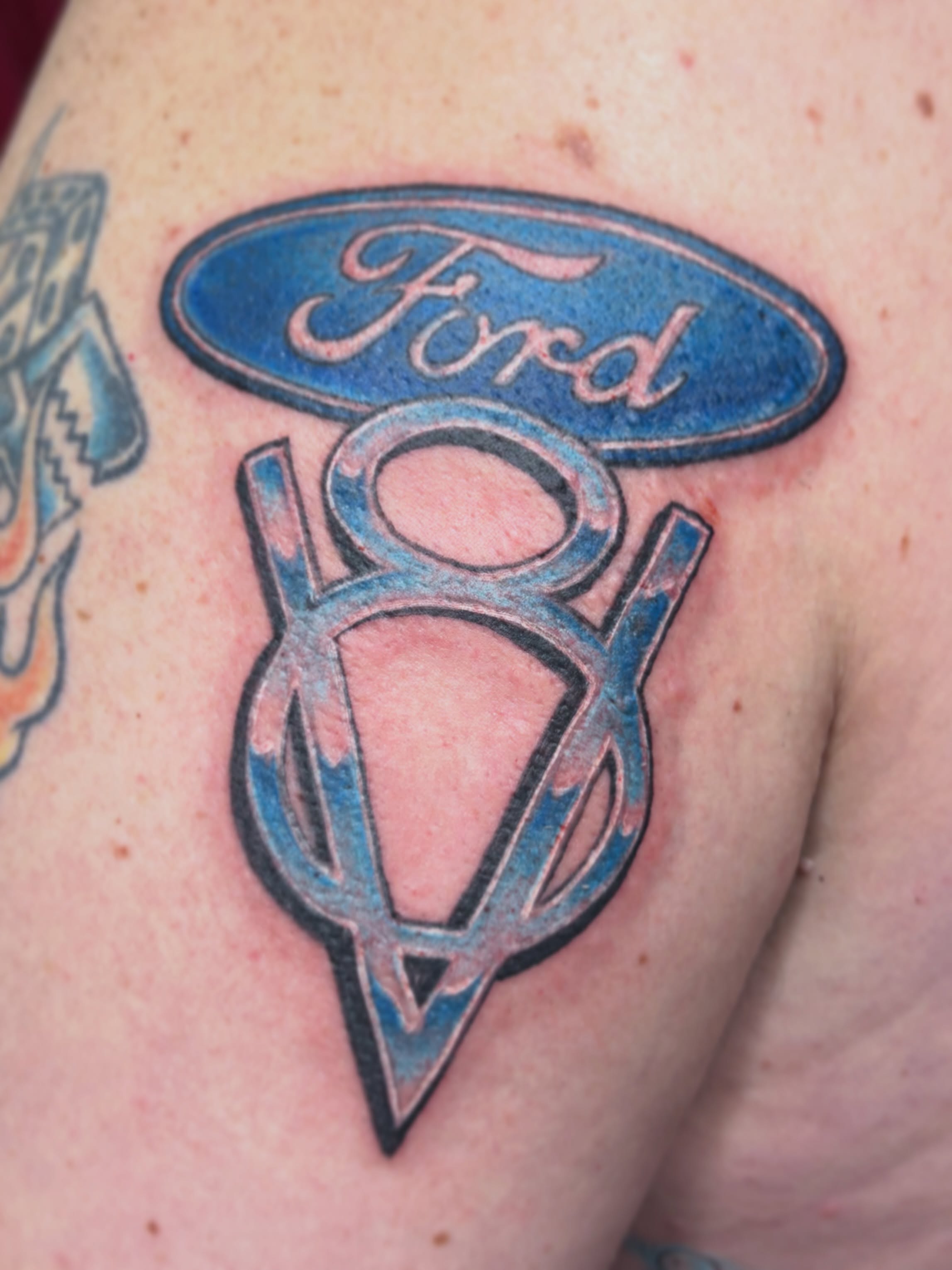 Ford logo American traditional tattoo on the shoulder by Ali Stanley, Virginia Beach, Virginia