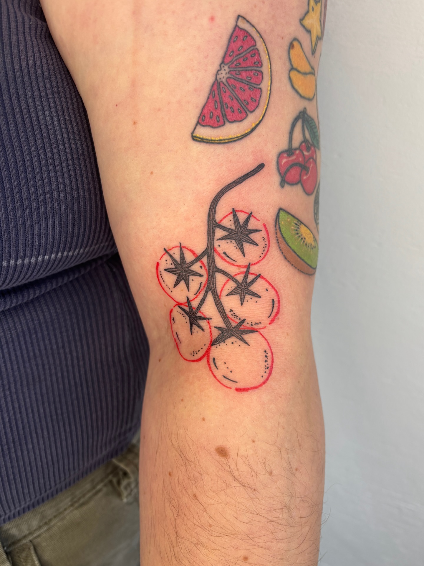 Fruit and cherry branch new school tattoo on the forearm by Raye