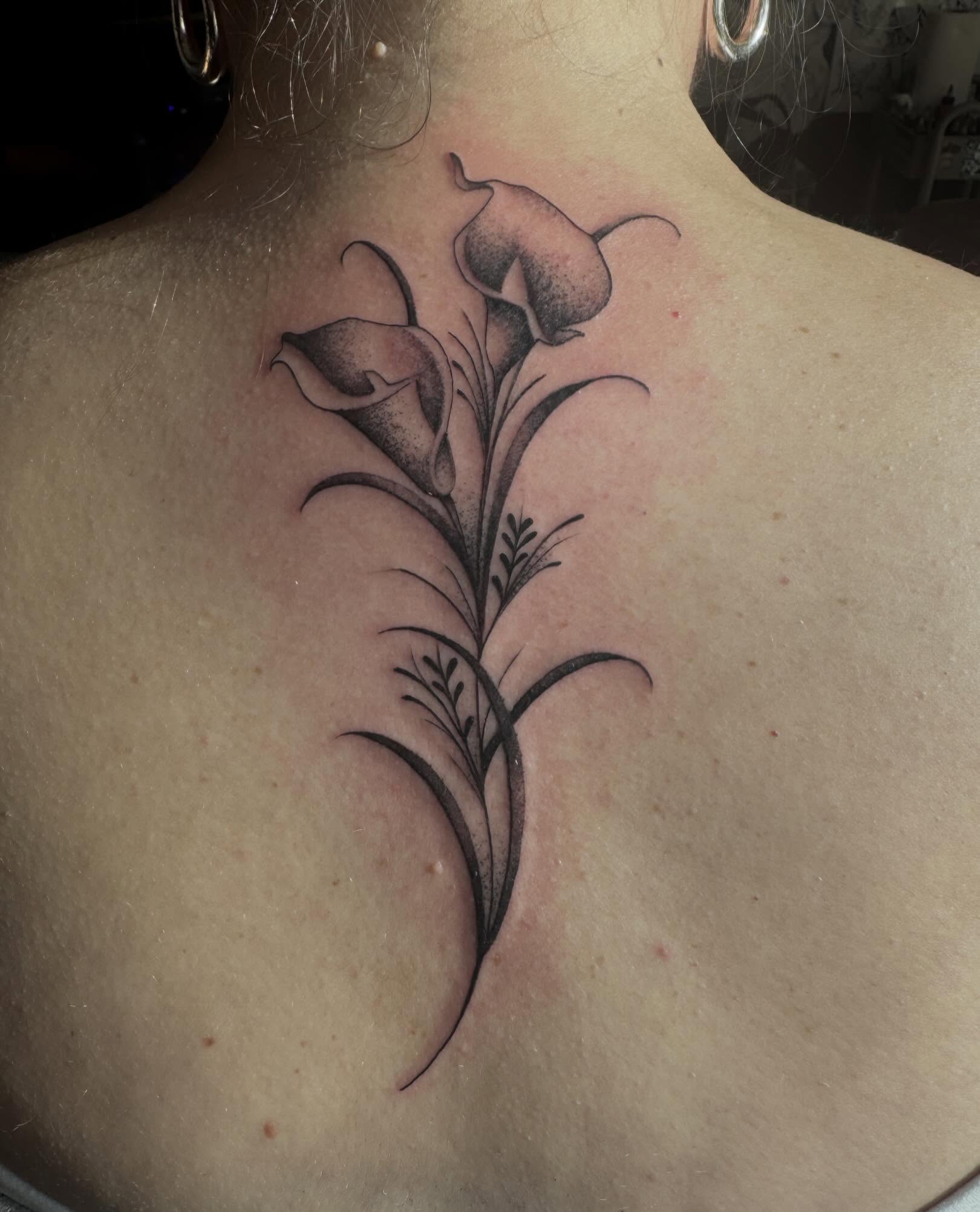 Calla lilies black and grey tattoo on the back by Tattoo, San Diego, California