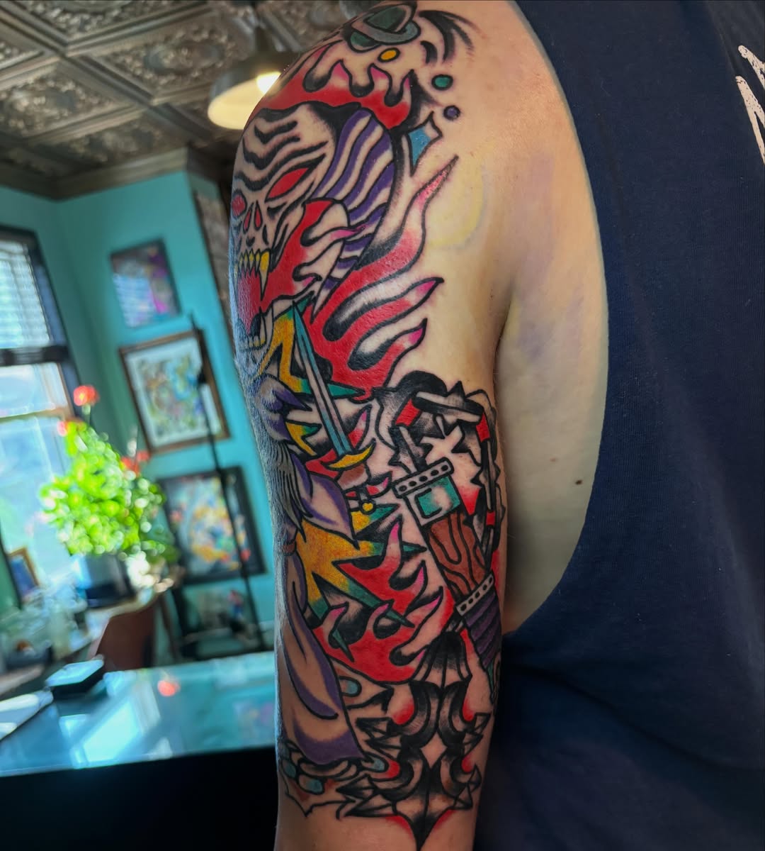 Japanese irezumi American traditional tattoo on the upper arm by Mitch Ashpaugh