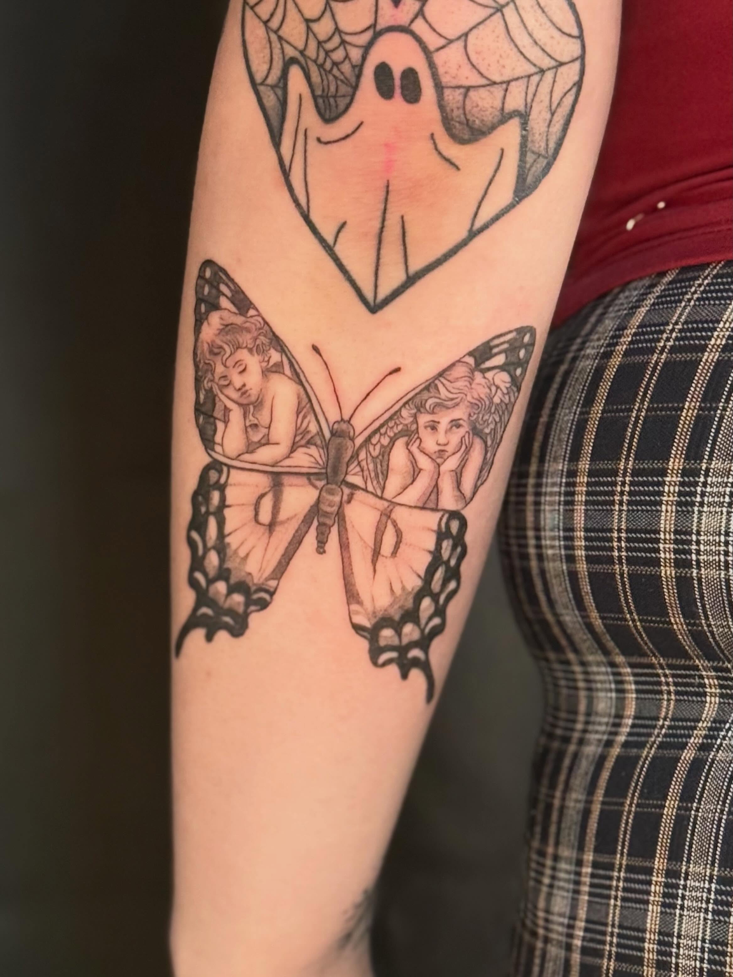 Ghost and butterfly realism tattoo on the forearm by Olivia, Royal Oak, Michigan