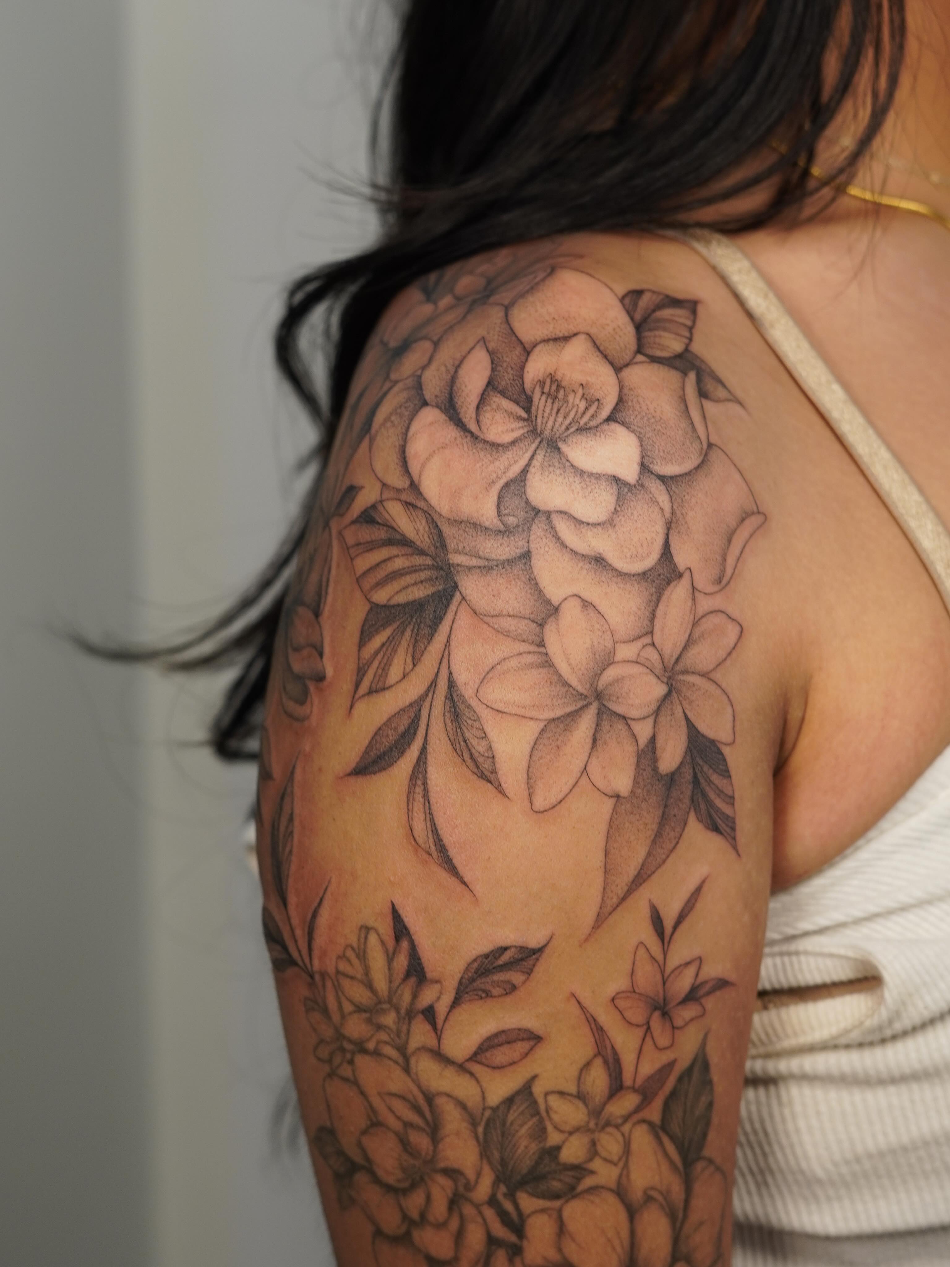Floral bouquet black and grey tattoo on the shoulder by Danae Andino