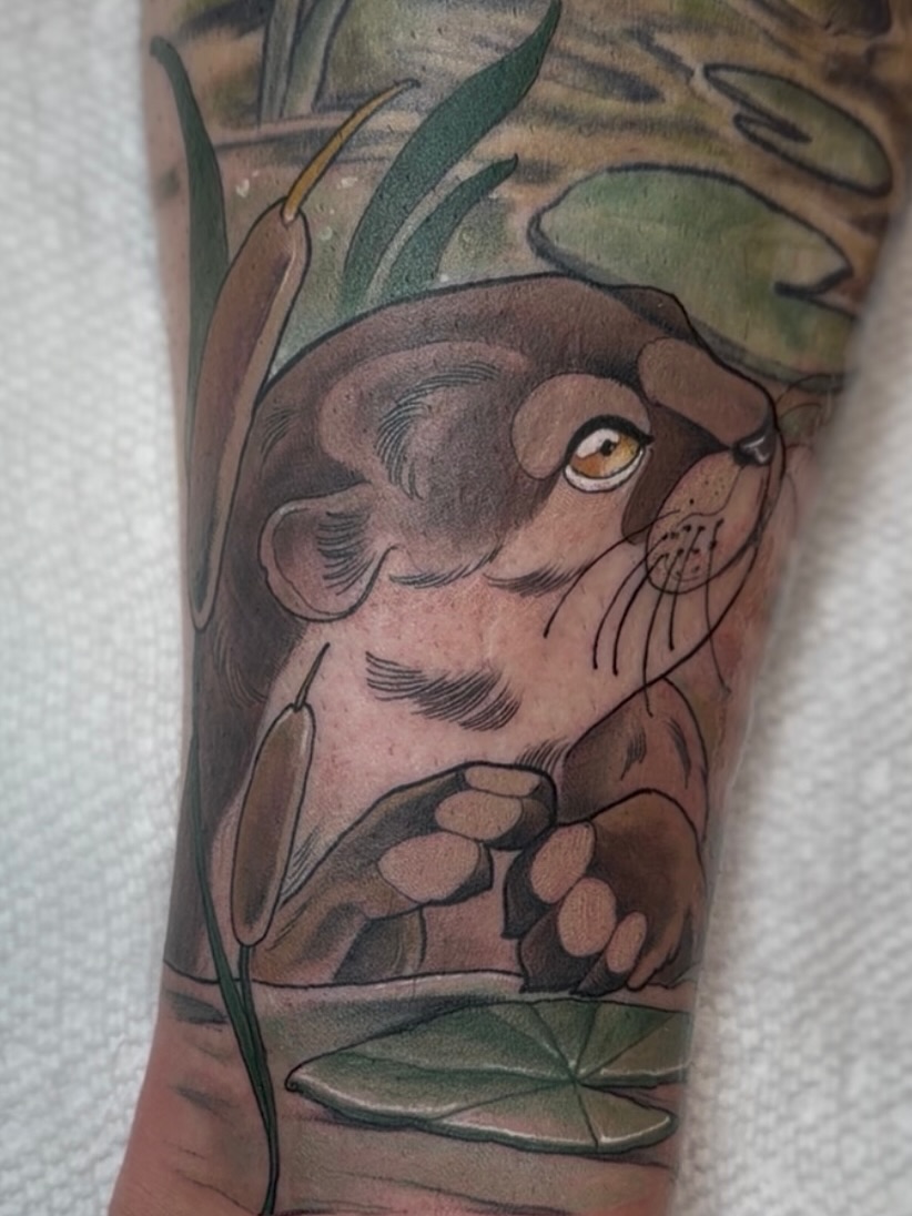 Lion cub realism tattoo on the forearm by Jenn Golgan