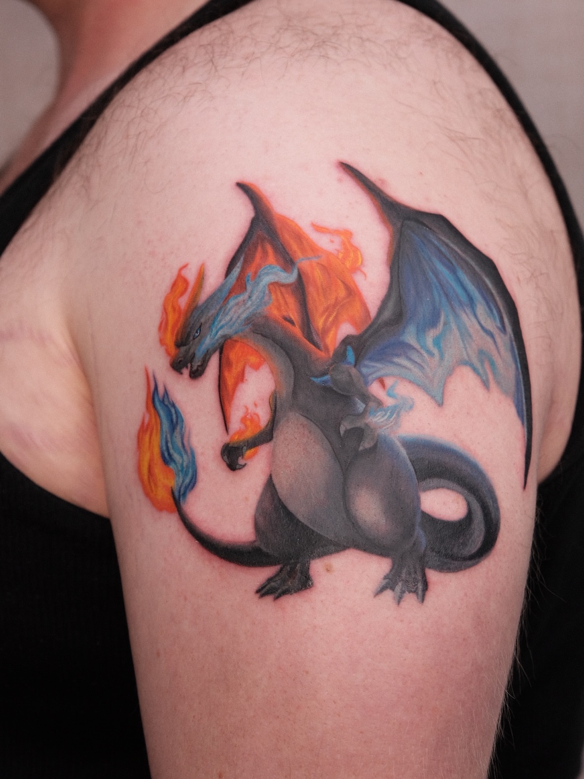 Dragon realism tattoo on the shoulder by Houston Tattoo Artist GoldenK
