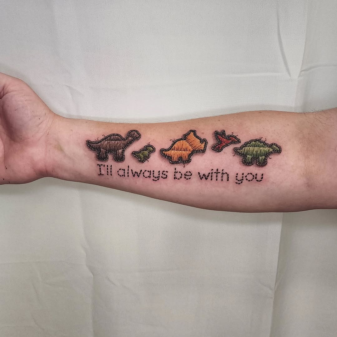 Dinosaur family dotwork tattoo on the forearm by Lindsey Andrew, Englewood, Colorado
