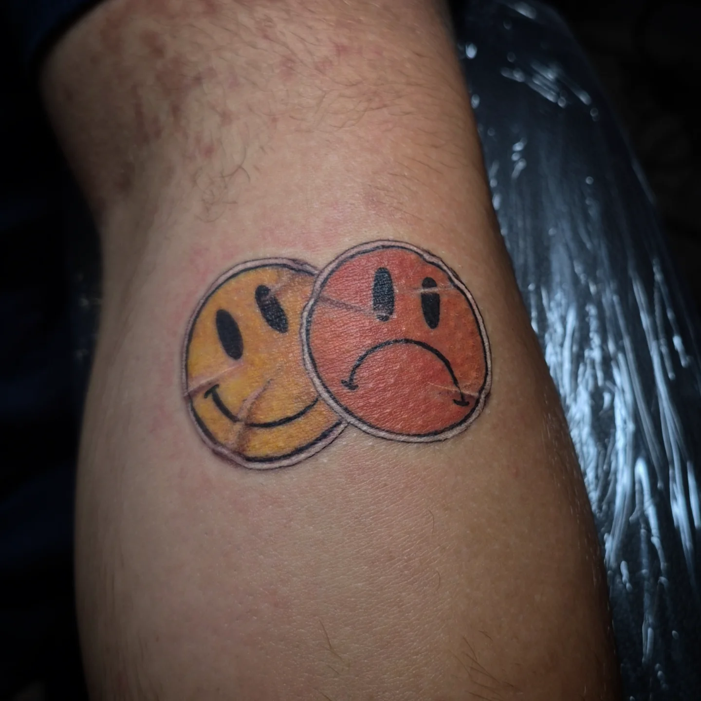 Smiley faces dotwork tattoo on the forearm by Lydia Kiley