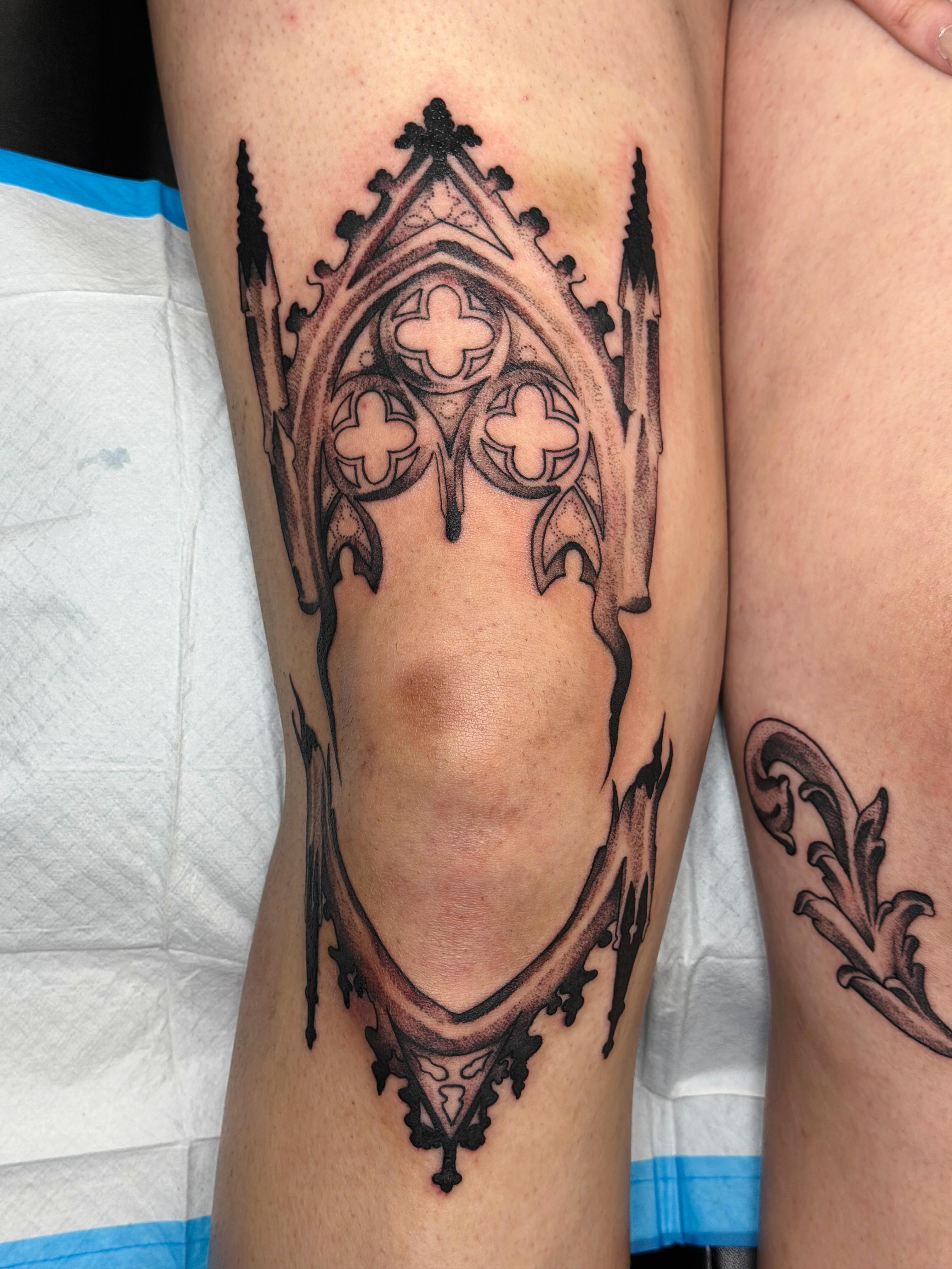 Gothic cathedral black and grey tattoo on the leg by Emily