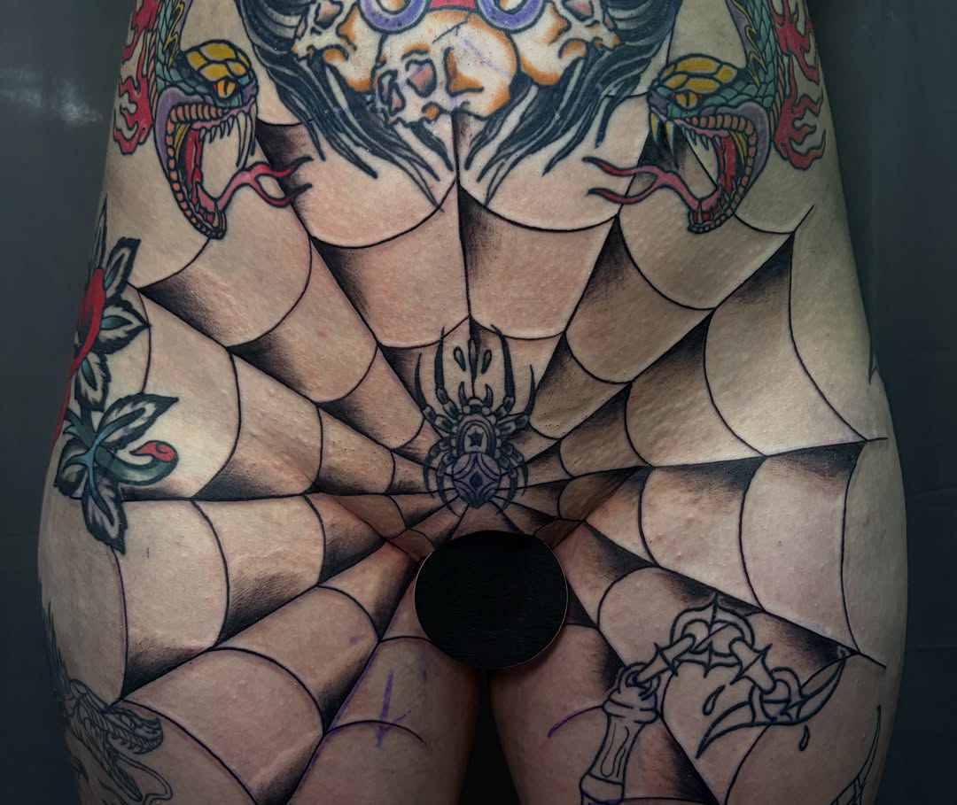 Spiderweb geometric tattoo on the thigh by BodyArtByAlia