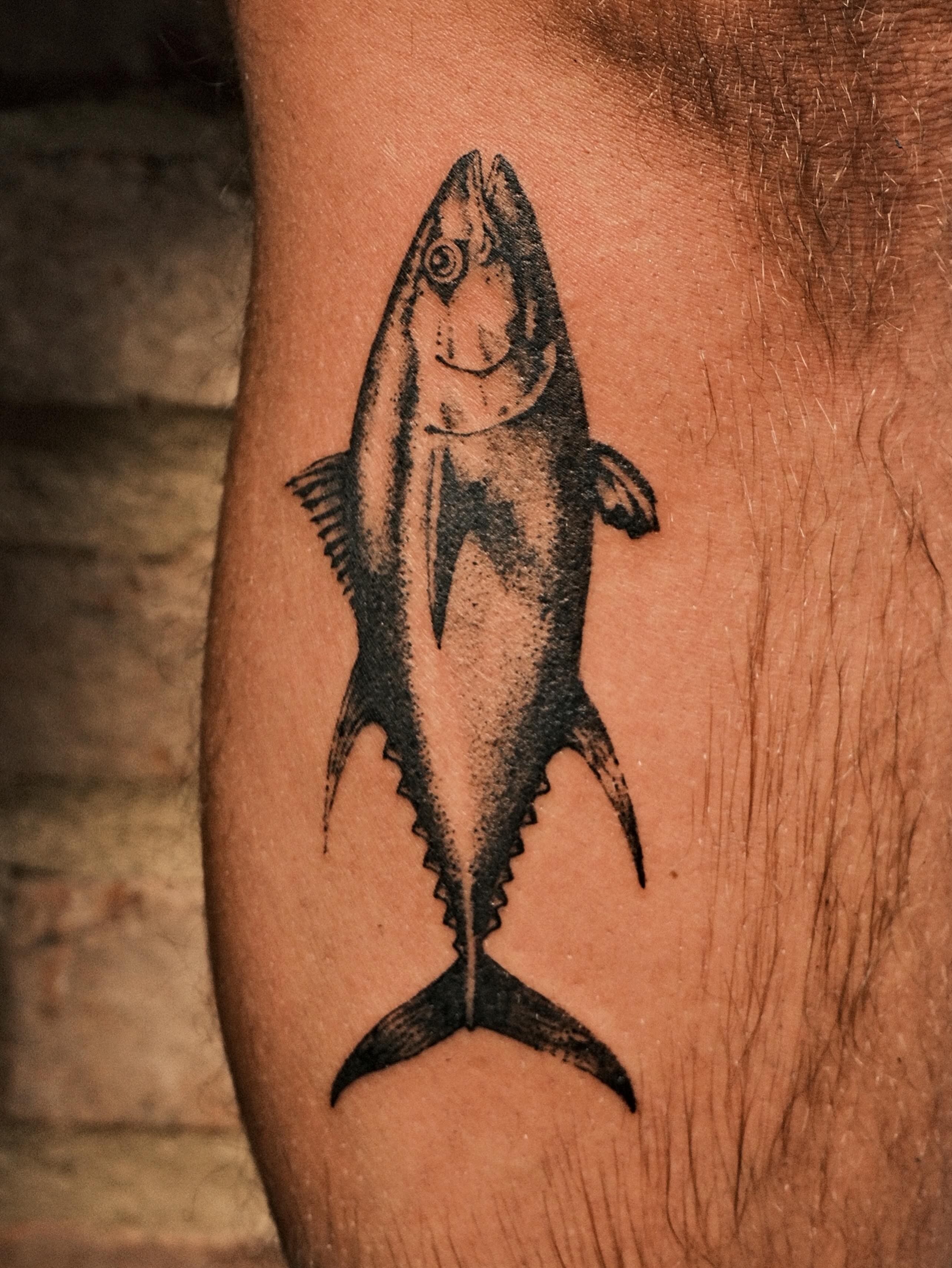 Tuna black and grey tattoo on the forearm by Ben Cisek