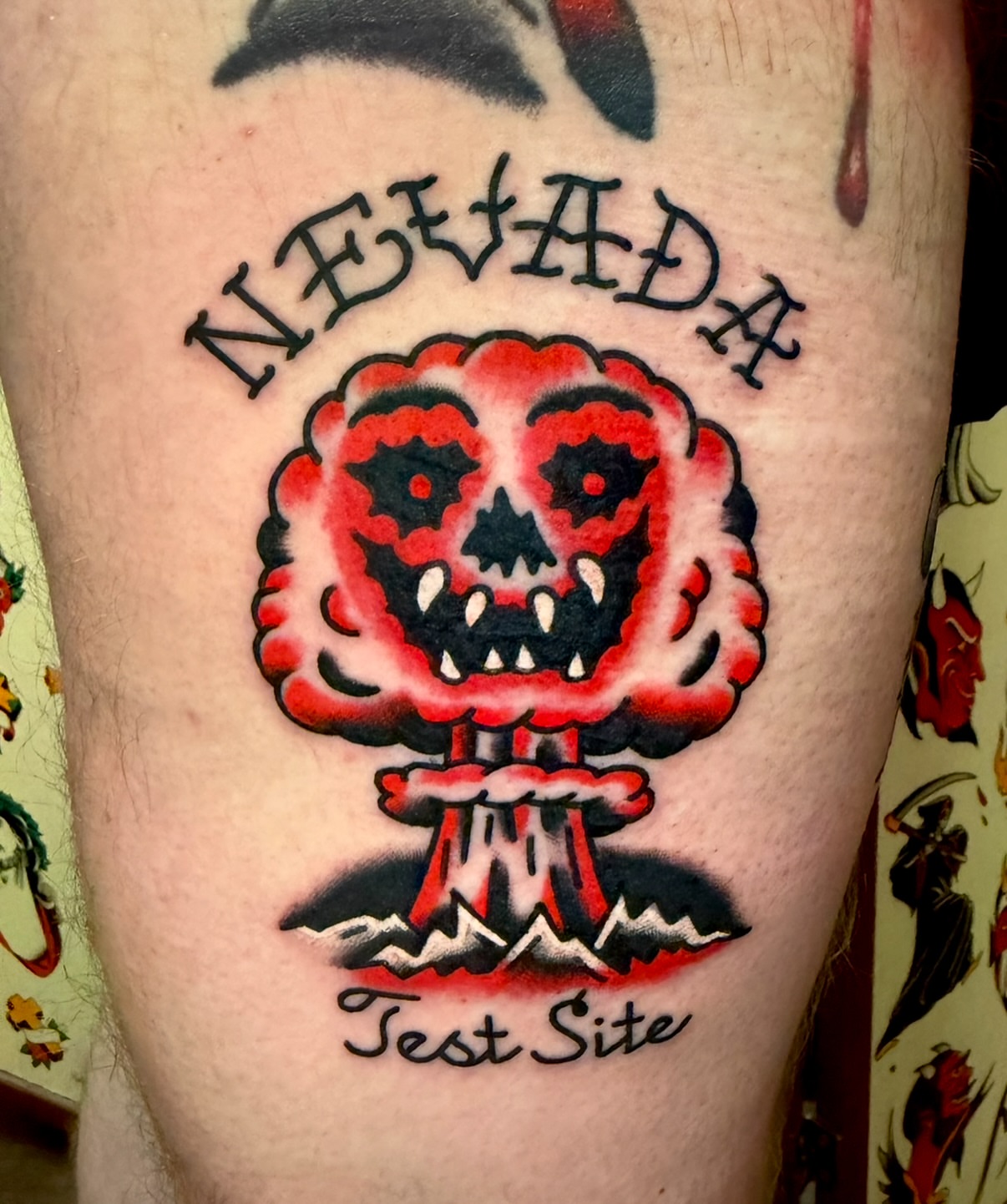 Nuclear explosion American traditional tattoo on the thigh by Buddy (Holiday) Orr, Las Vegas, Nevada
