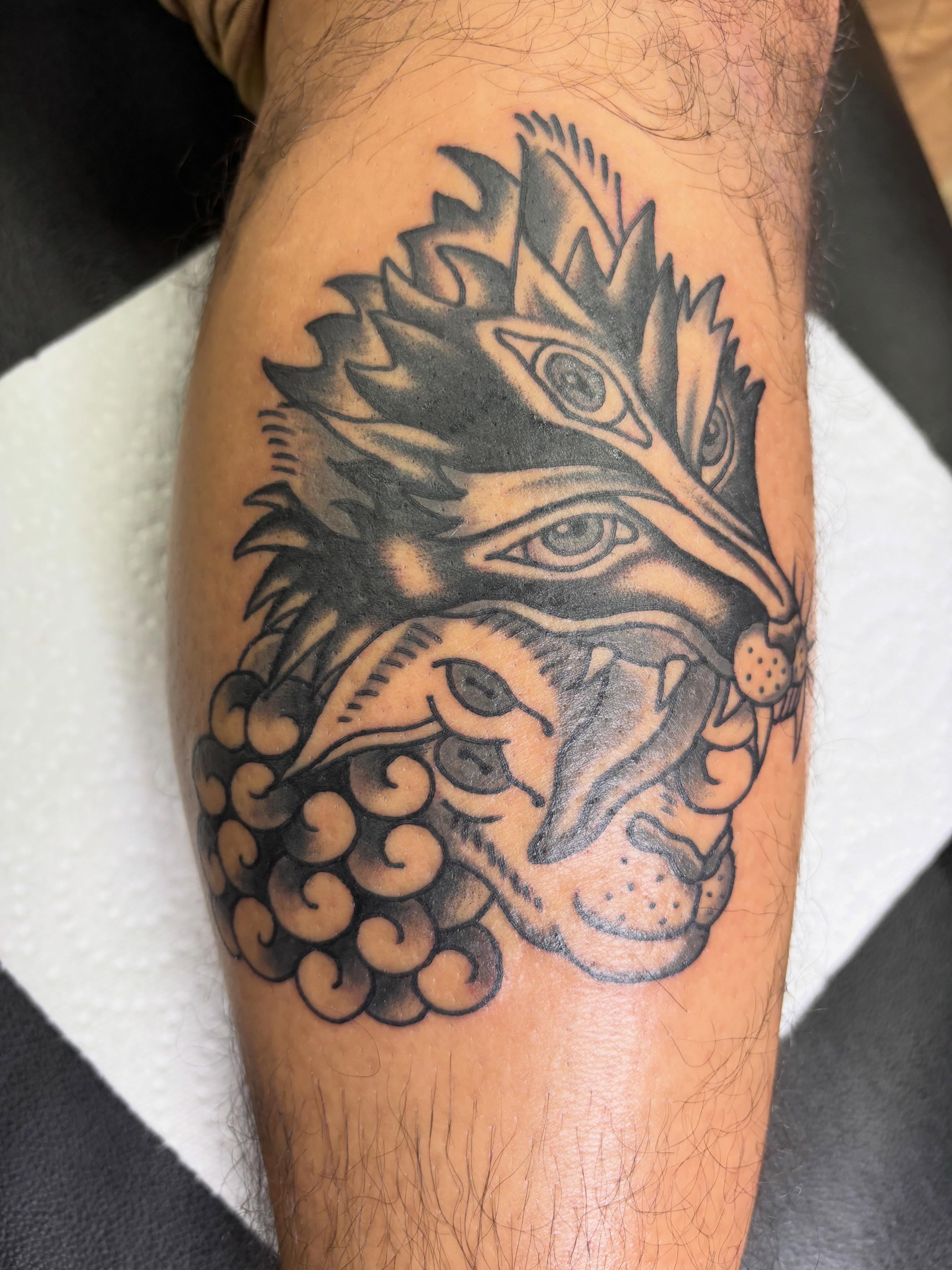 Lion black and grey tattoo on the forearm by Jay