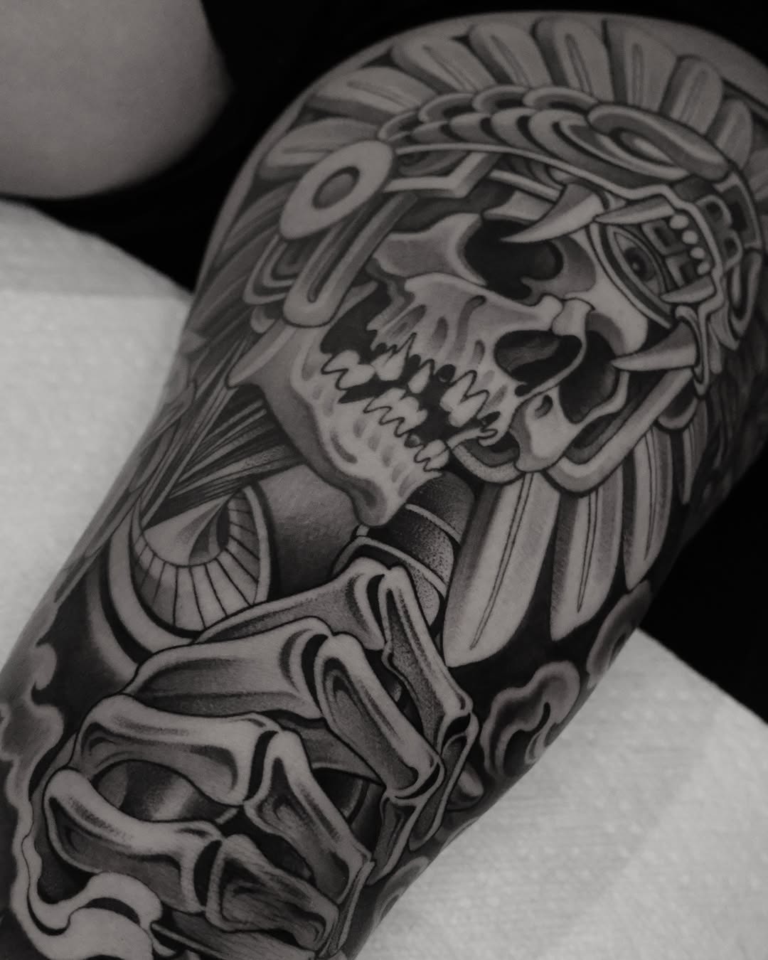 Skull with headdress and skeleton hand realism tattoo on the forearm by ๐ฃ๐๐๐ ๐๐ ๐ฆ๐๐๐ฉ๐
