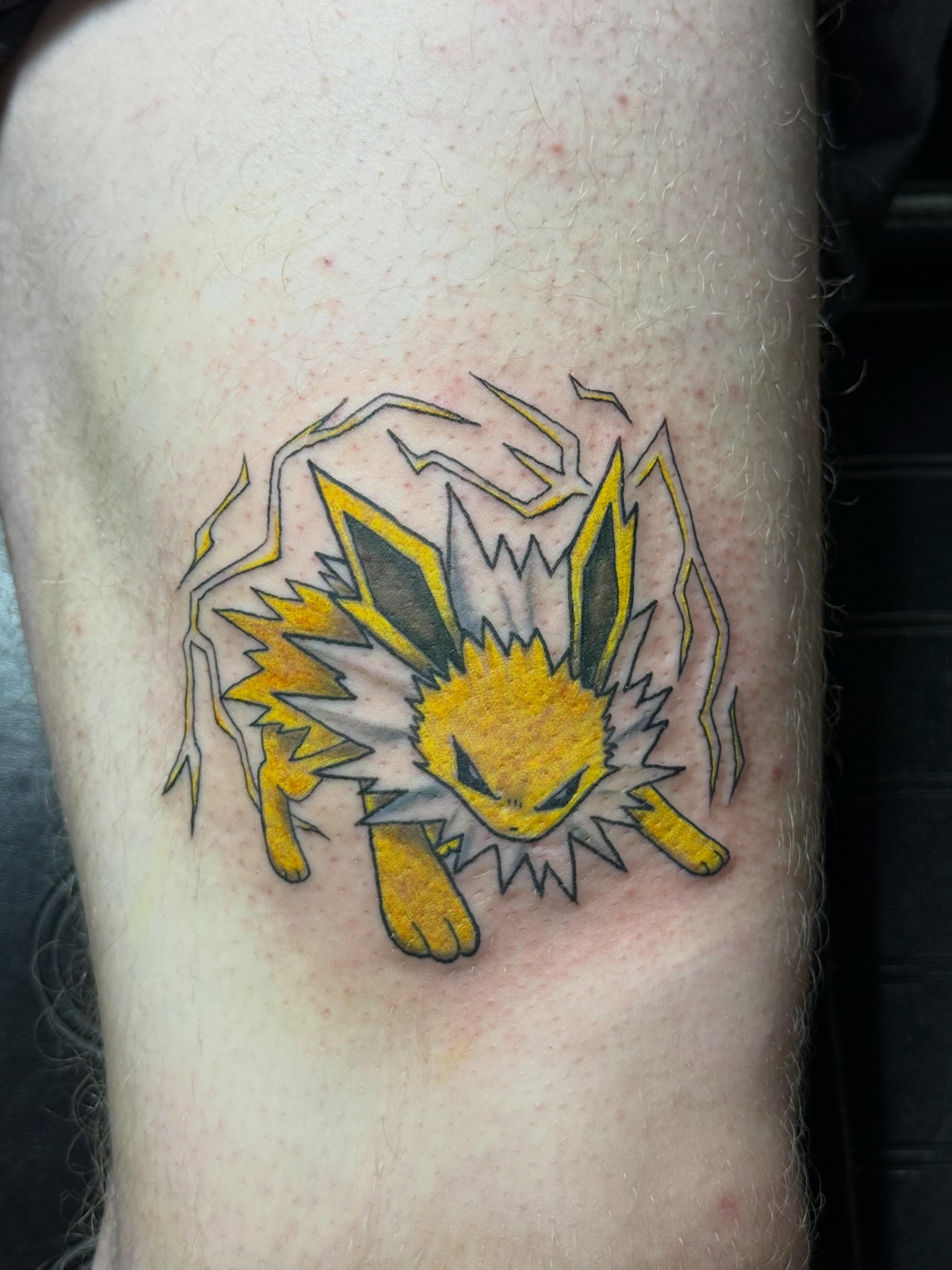 Jolteon new school tattoo on the forearm by Camryn Justice