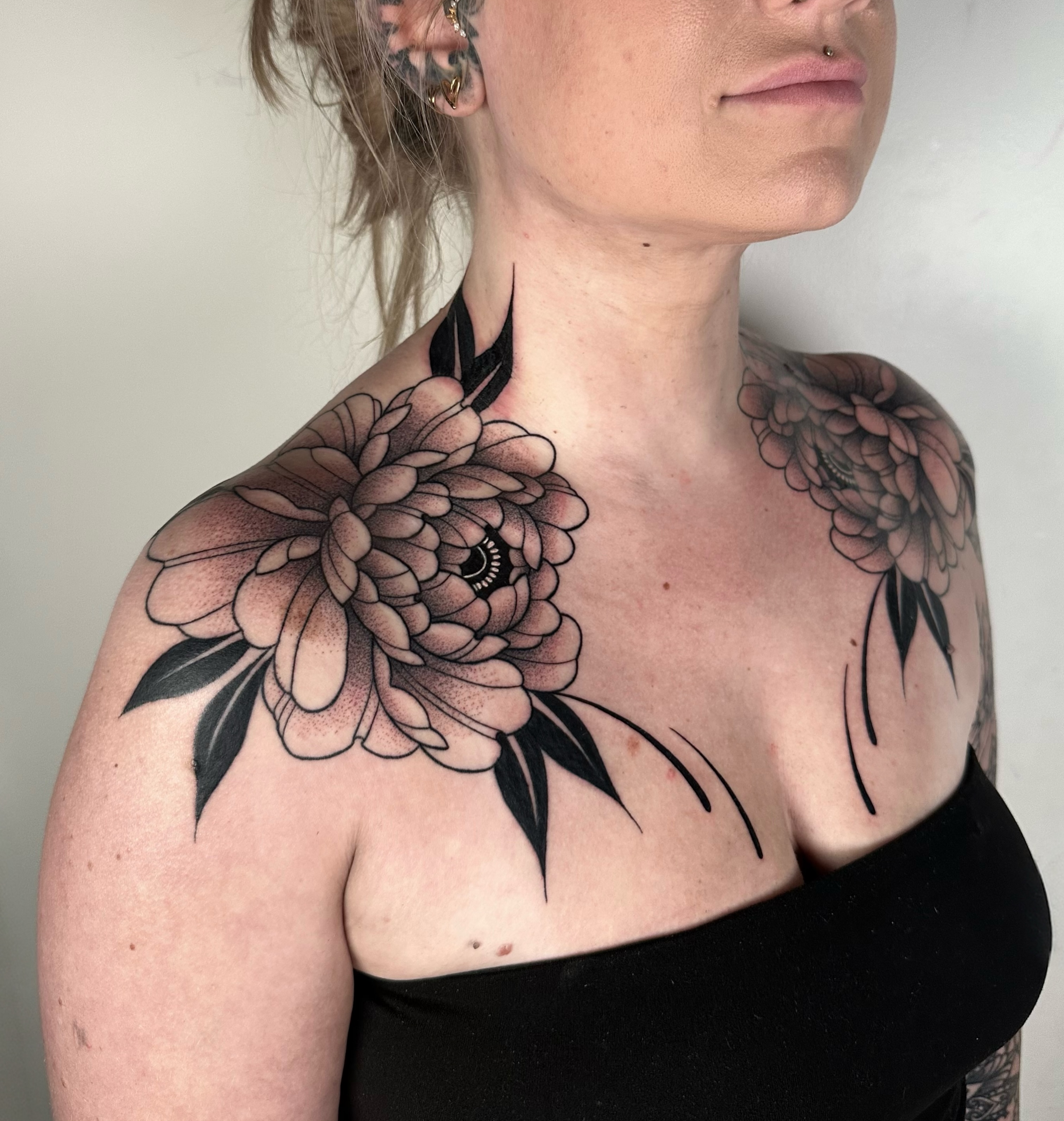 Peony dotwork tattoo on the chest by Brooklyn Bailey