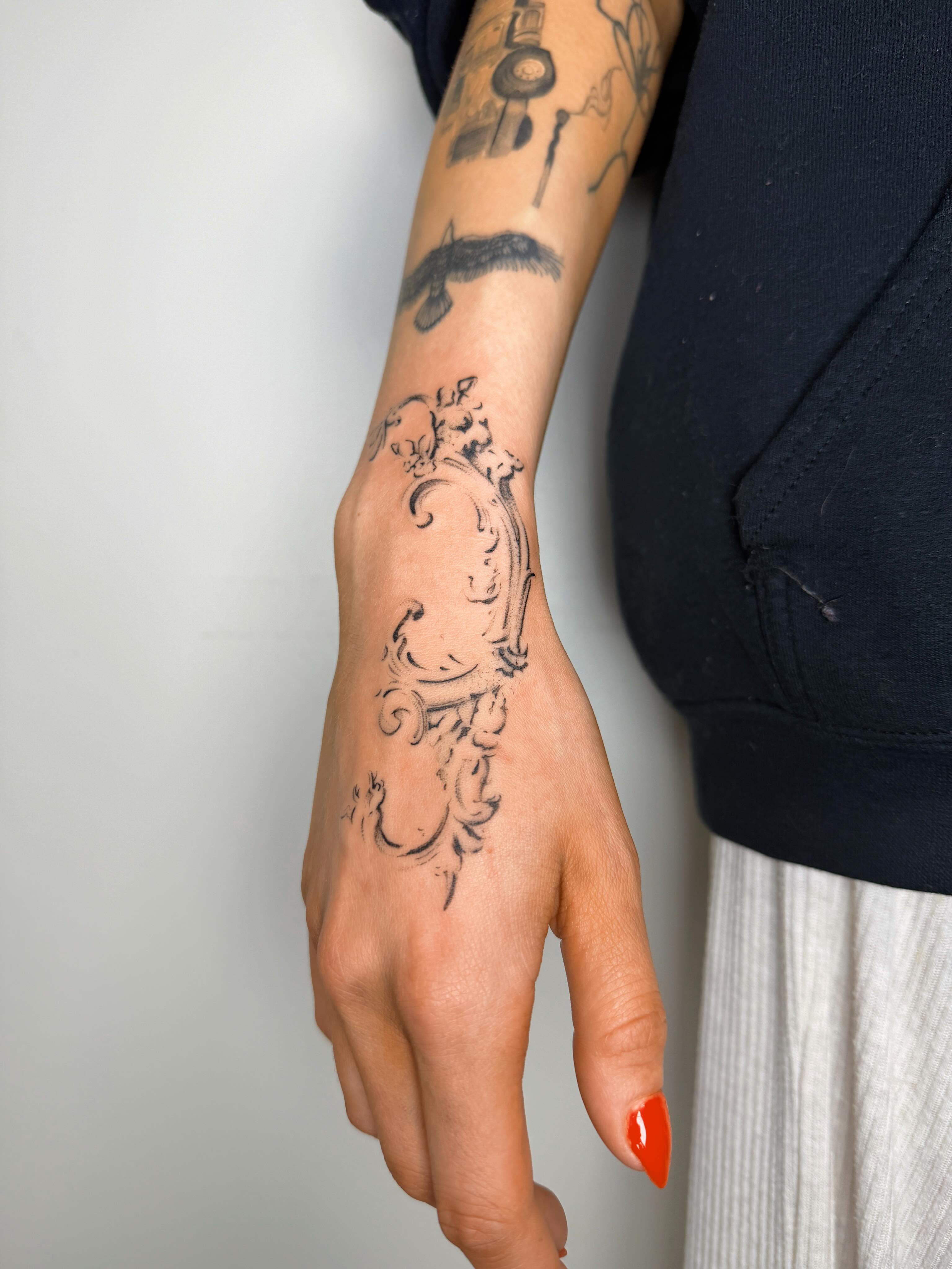 Ornamental ornamental tattoo on the forearm by Nate Weaver