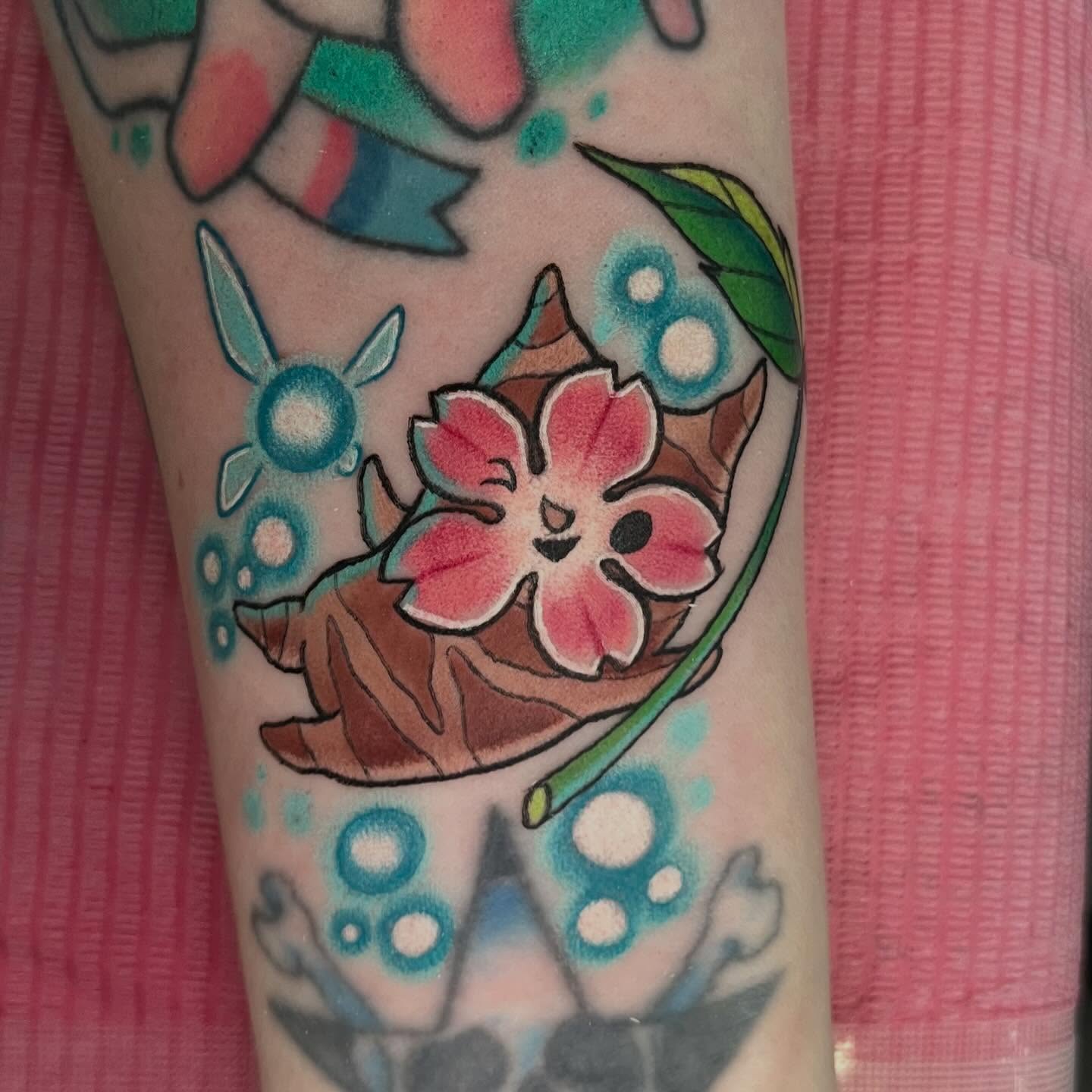 Flower and leaf American traditional tattoo on the forearm by Ash Wheeler