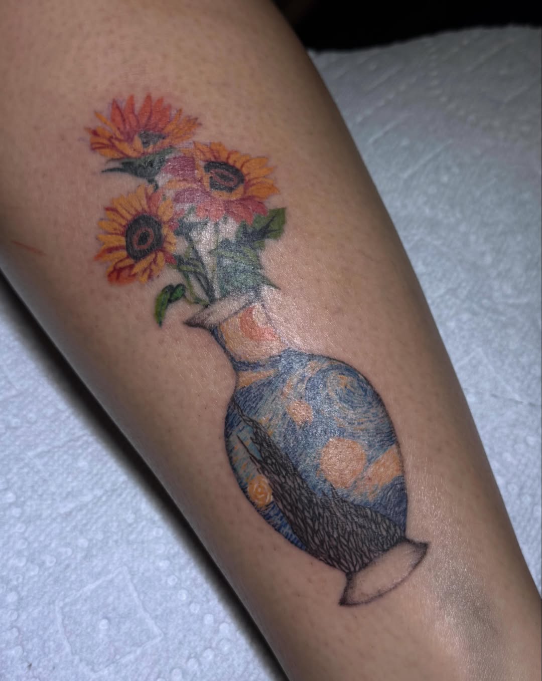 Sunflowers in vase realism tattoo on the forearm by Nat🫧