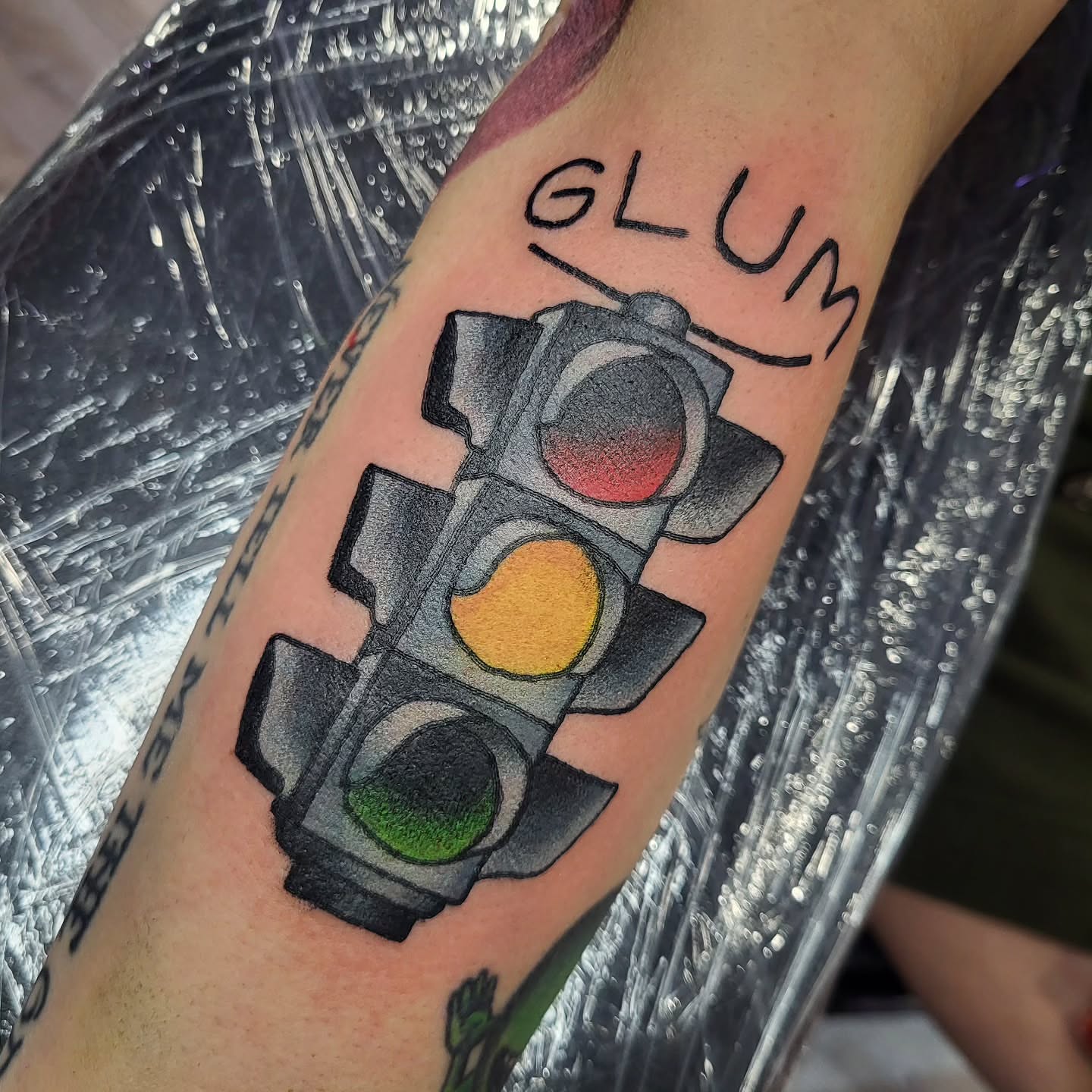 Traffic light American traditional tattoo on the forearm by Sloan Smith