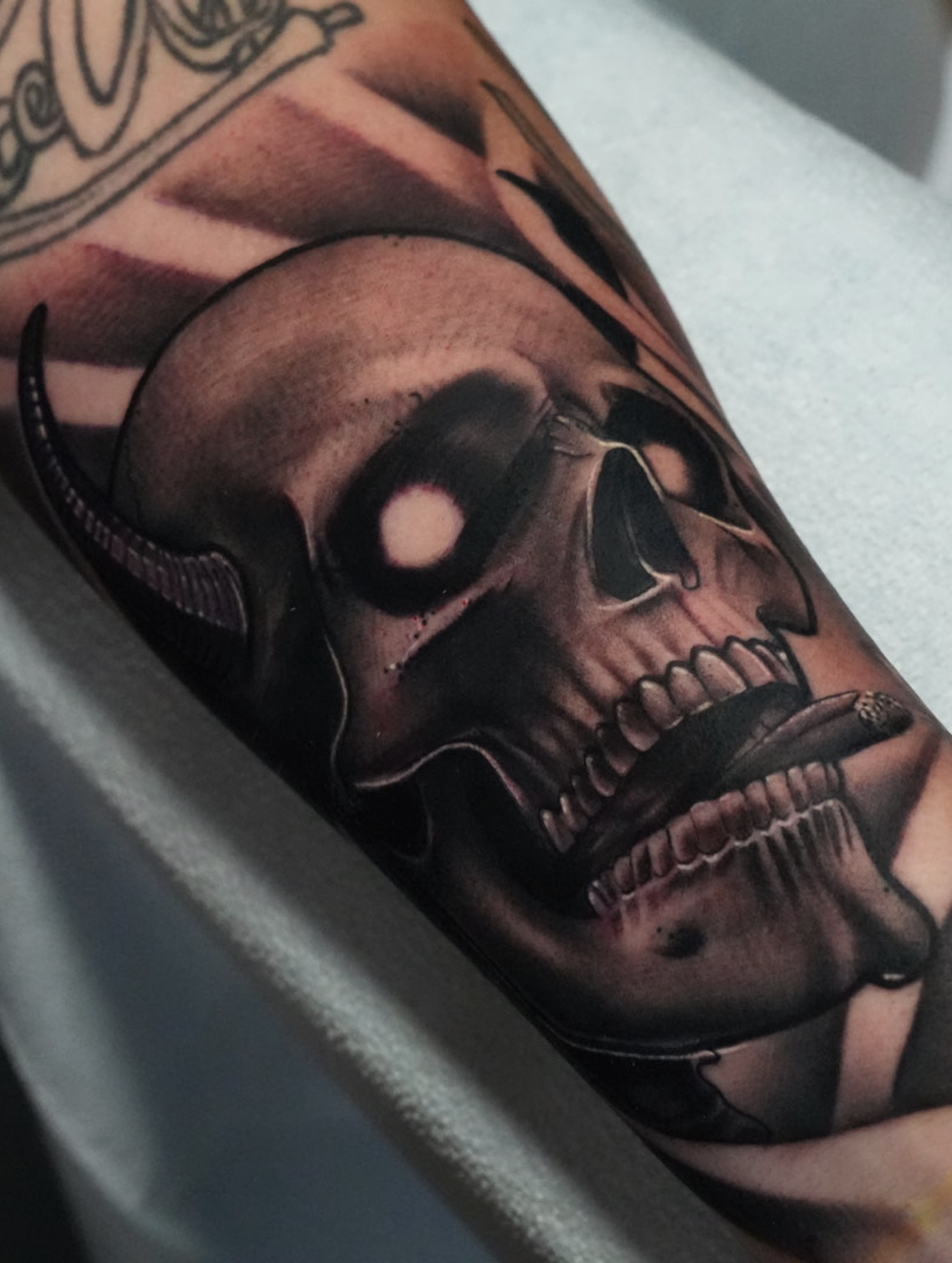 Skull dark realism tattoo on the forearm by Jaxx Kesler