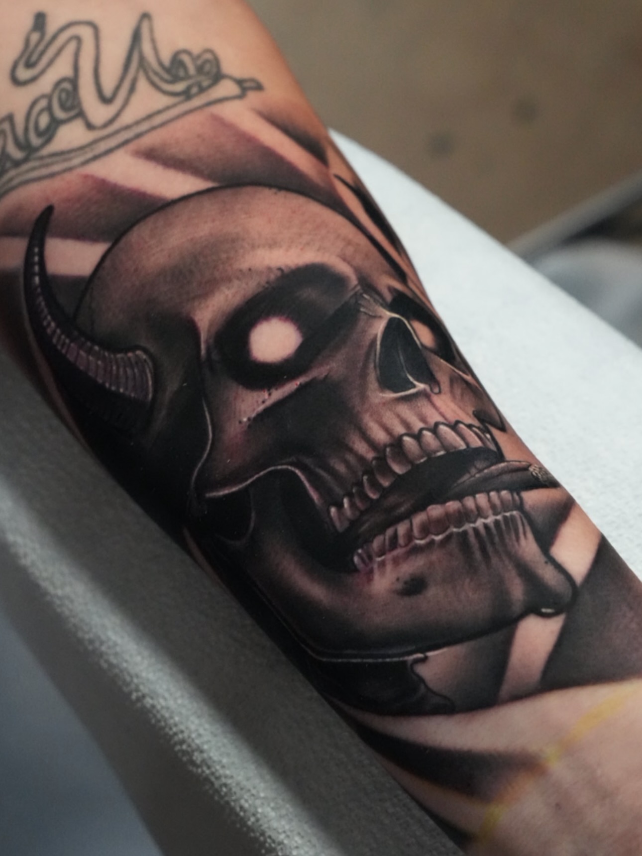 Skull dark realism tattoo on the forearm by Jaxx Kesler