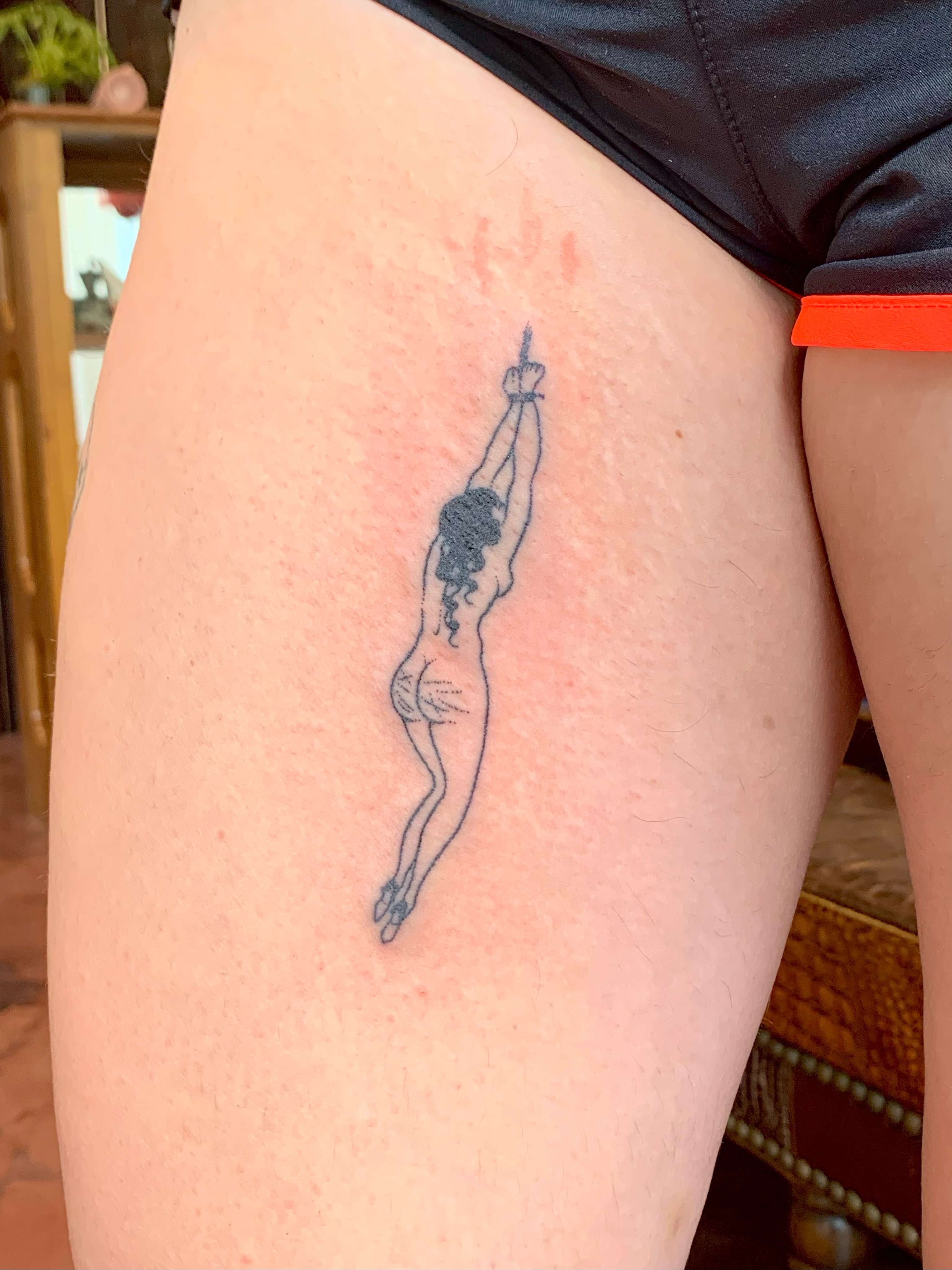 Diver black and grey tattoo on the thigh by Lex Lloyd