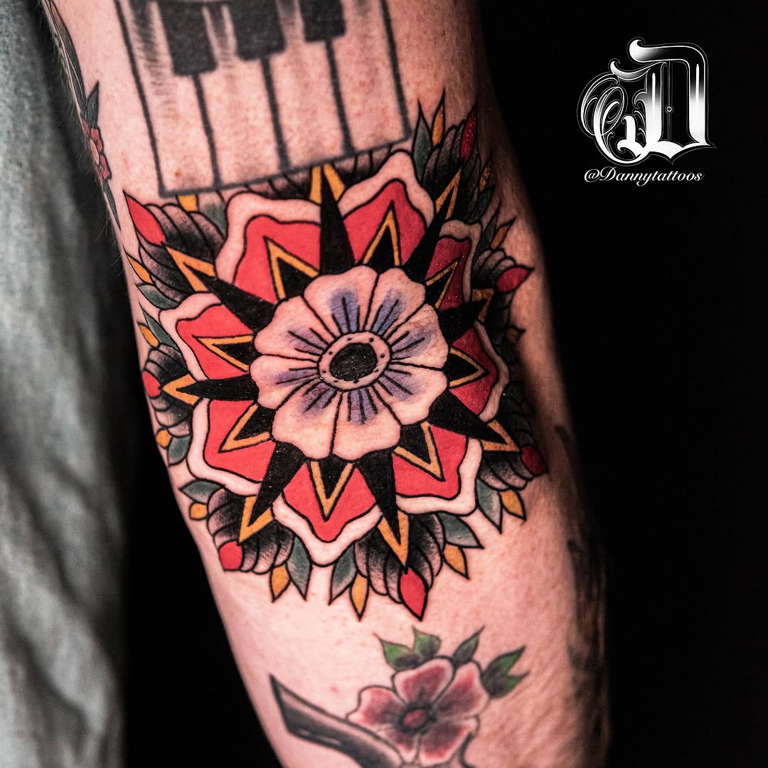 Flower American traditional tattoo on the forearm by Danny Pando