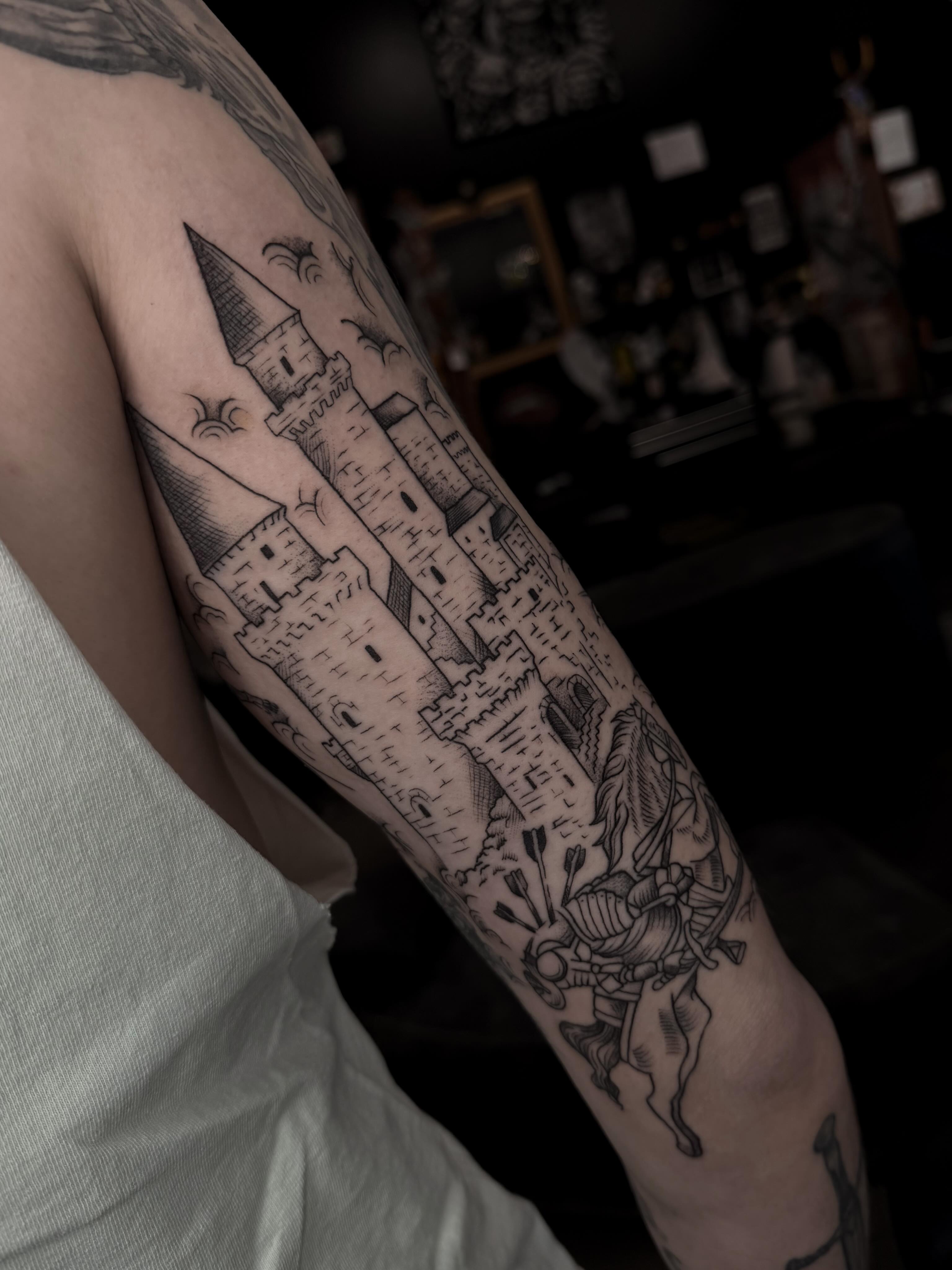 Castle and knight black and grey tattoo on the forearm by Susie Maj