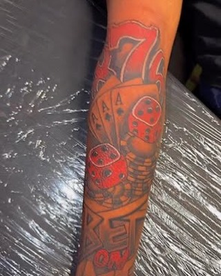 Realism tattoo on the forearm by Marcus Carter