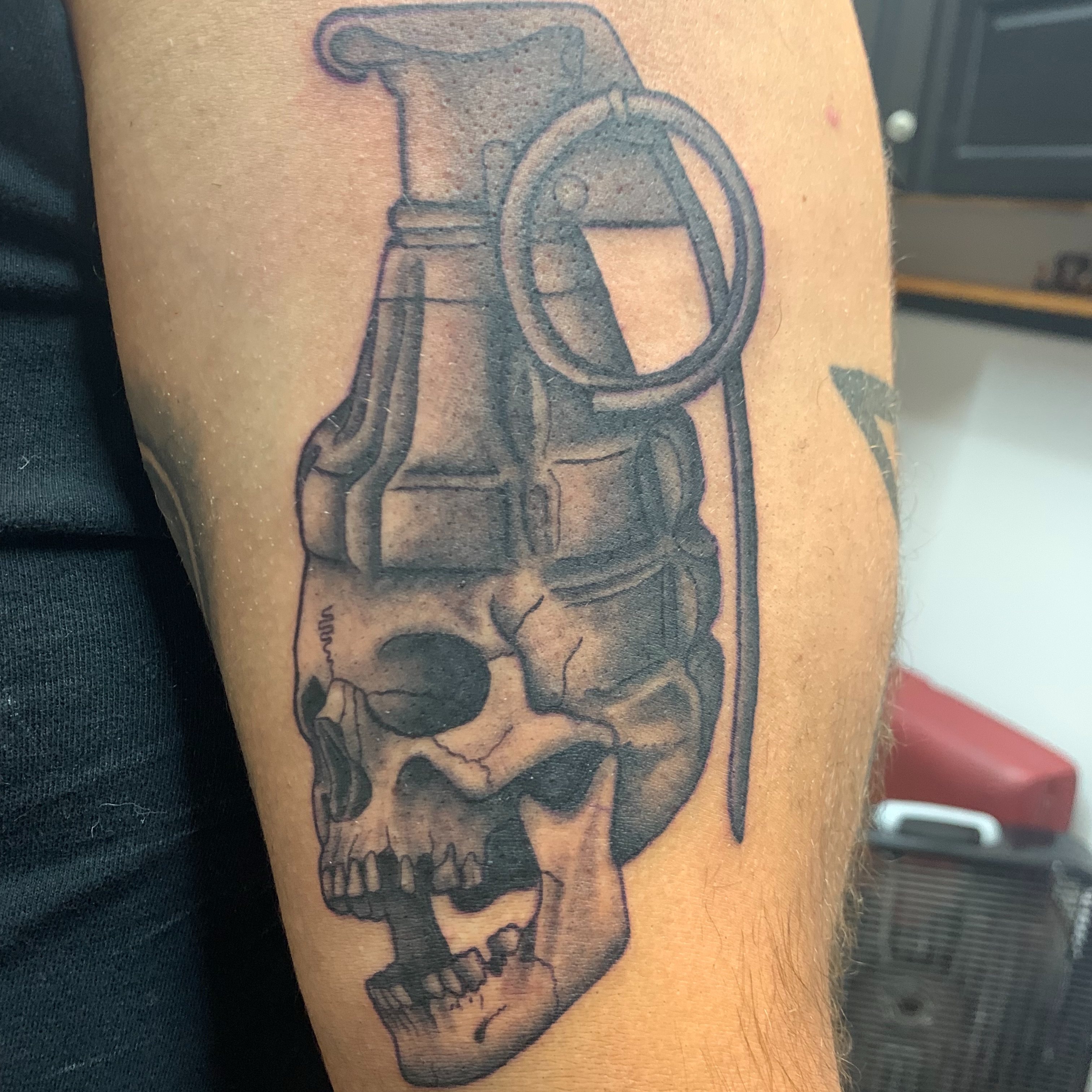 Grenade skull realism tattoo on the forearm by (Joshua) Van Cummings