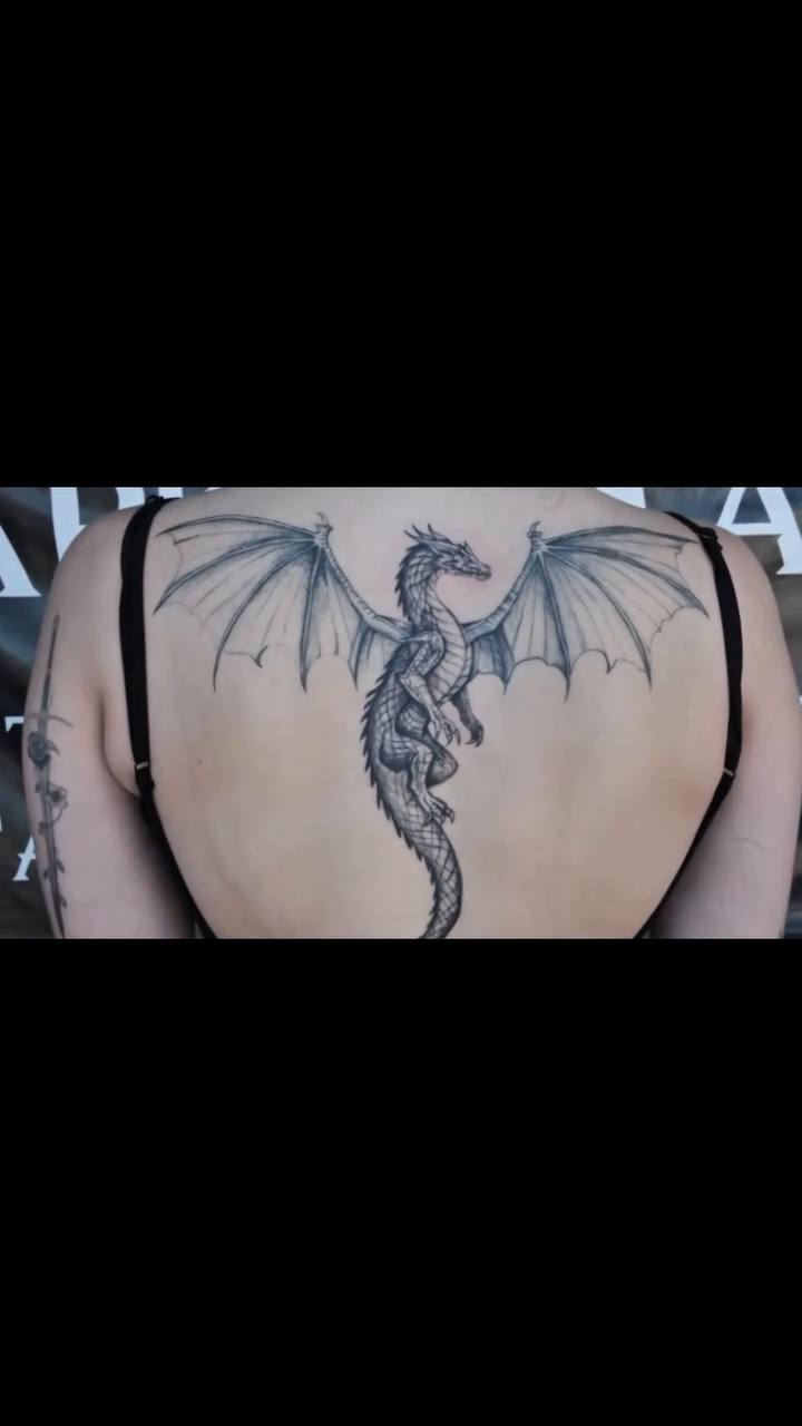 Dragon tattoo on back blackwork tattoo on the back by Gisette Gomez