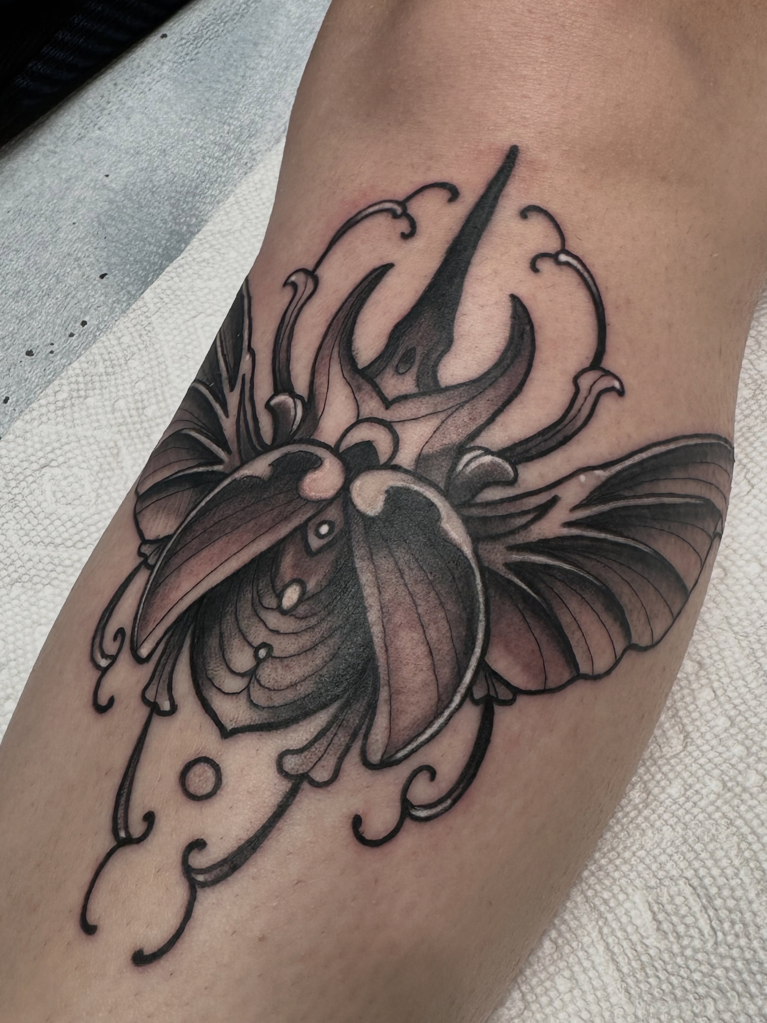 Butterfly black and grey tattoo on the forearm by Christopher Layman