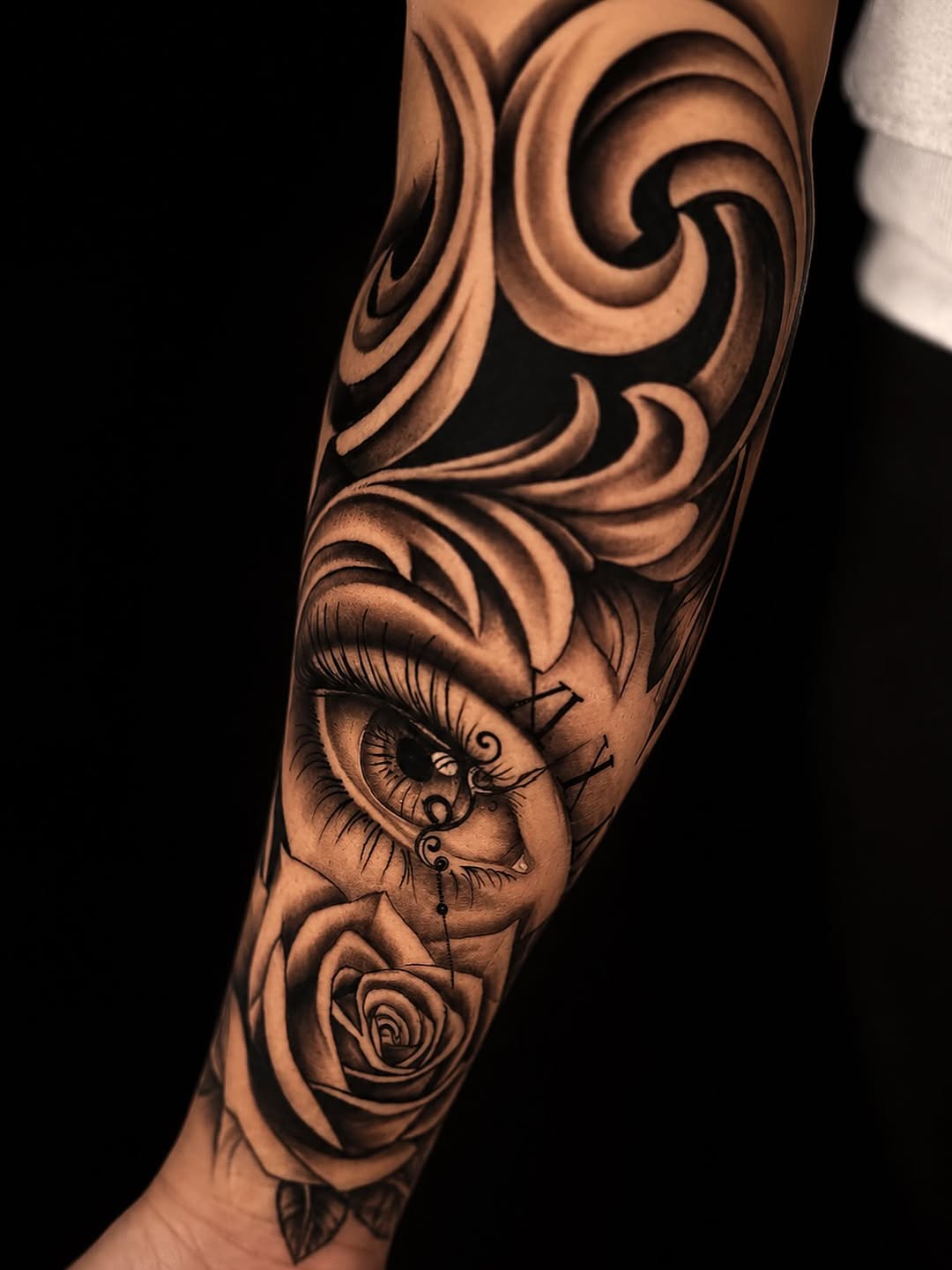 Eye and rose with clock elements Chicano tattoo on the forearm by Shane Boss, Toronto, Ontario