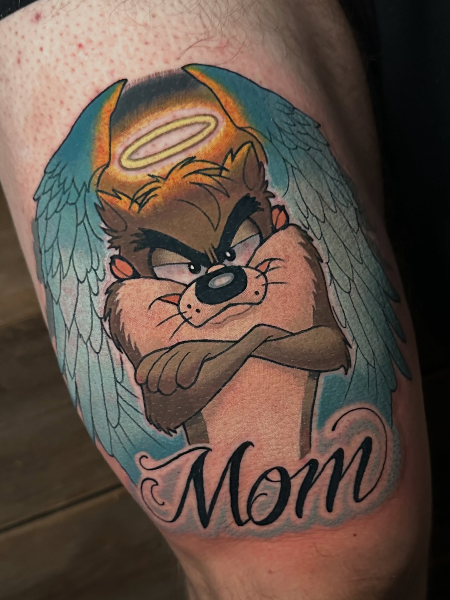 Tazmanian Devil illustrative tattoo on the thigh by Joe Friedman