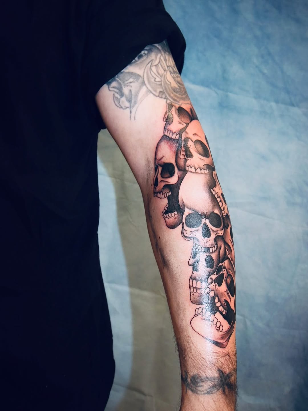 Stack of skulls realism tattoo on the forearm by π’ππ΅π΅π΄ π©°π