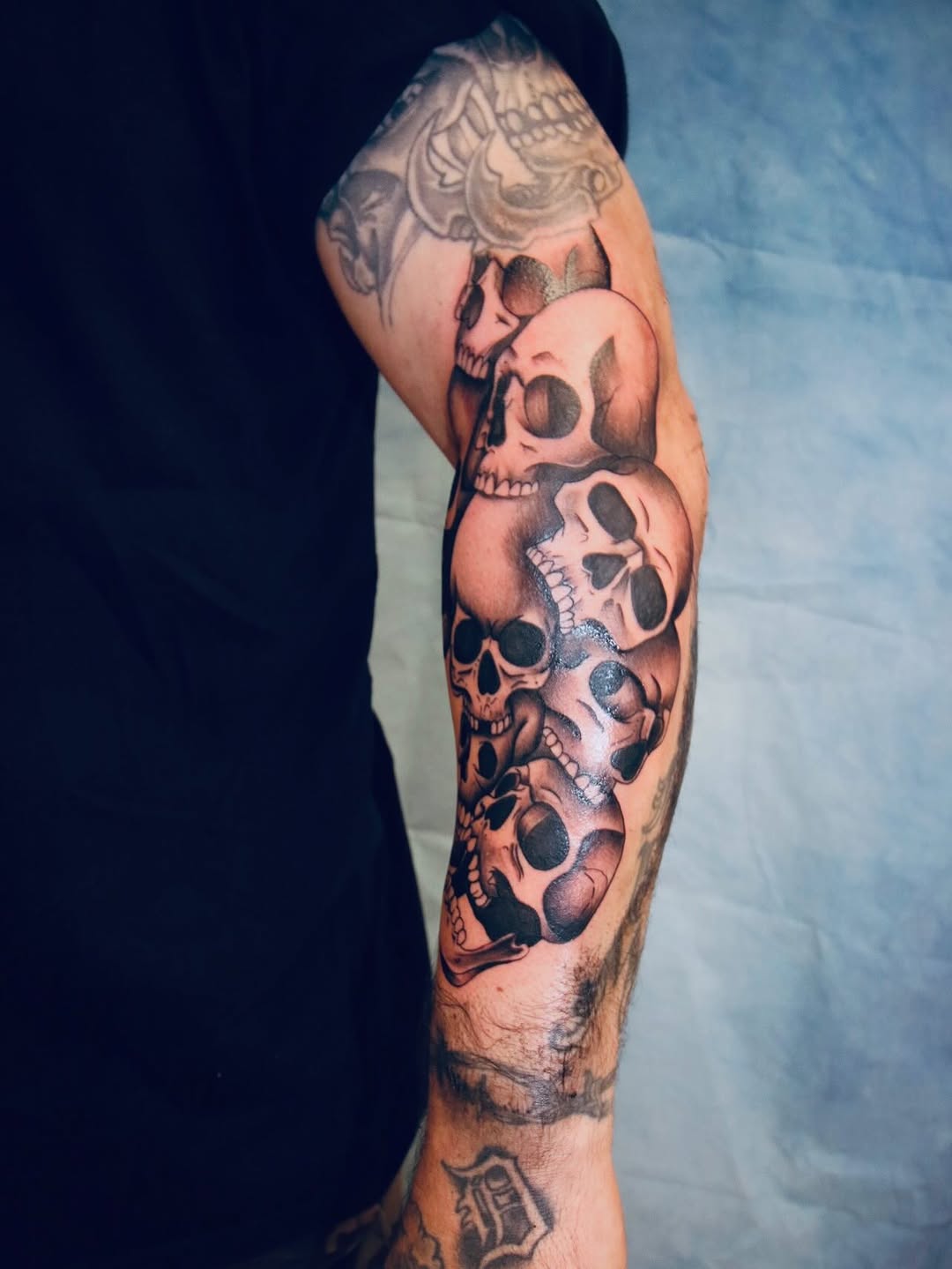 Stack of skulls realism tattoo on the forearm by π’ππ΅π΅π΄ π©°π