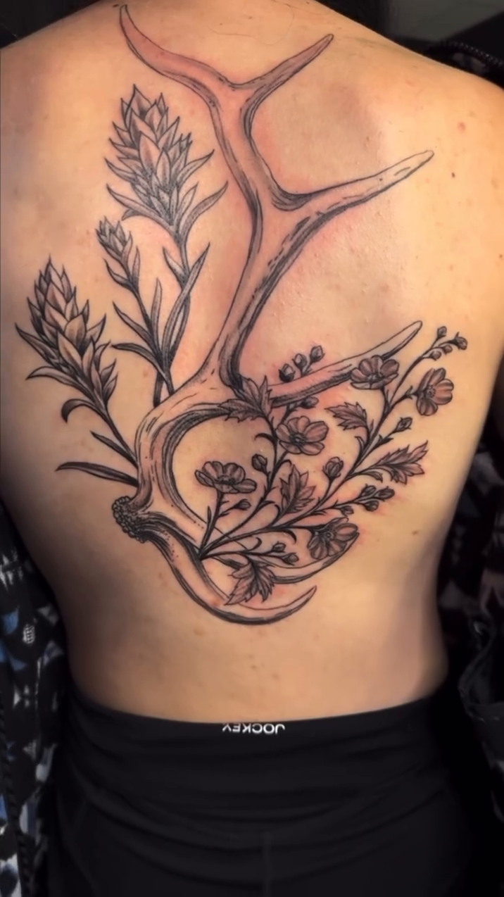 Antlers with floral elements blackwork tattoo on the back by Greg Romero (el chamo), Millcreek, Utah