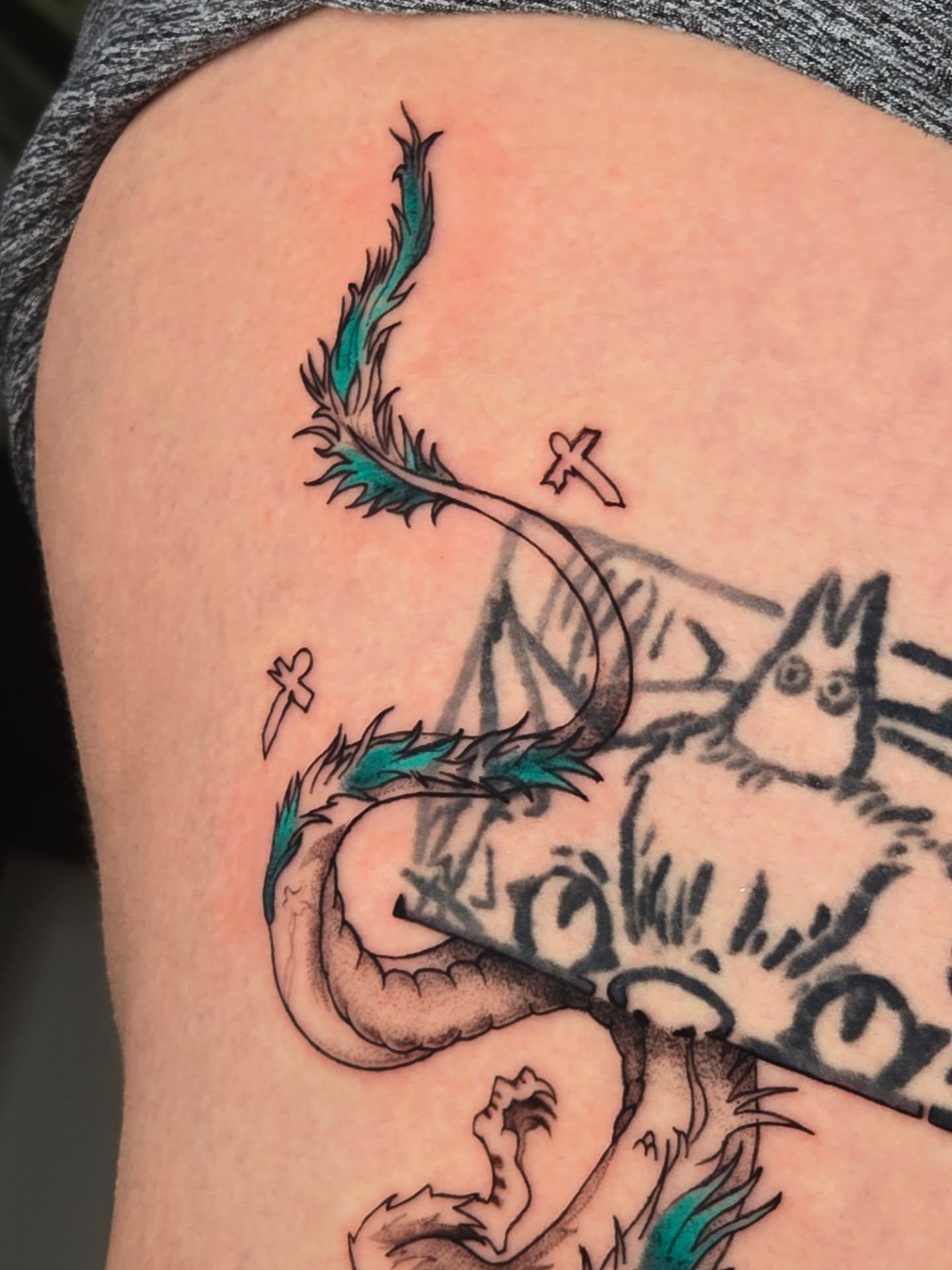 Dragon and feather neo-traditional tattoo on the thigh by Scribbles (Teala René), Charlotte, North Carolina